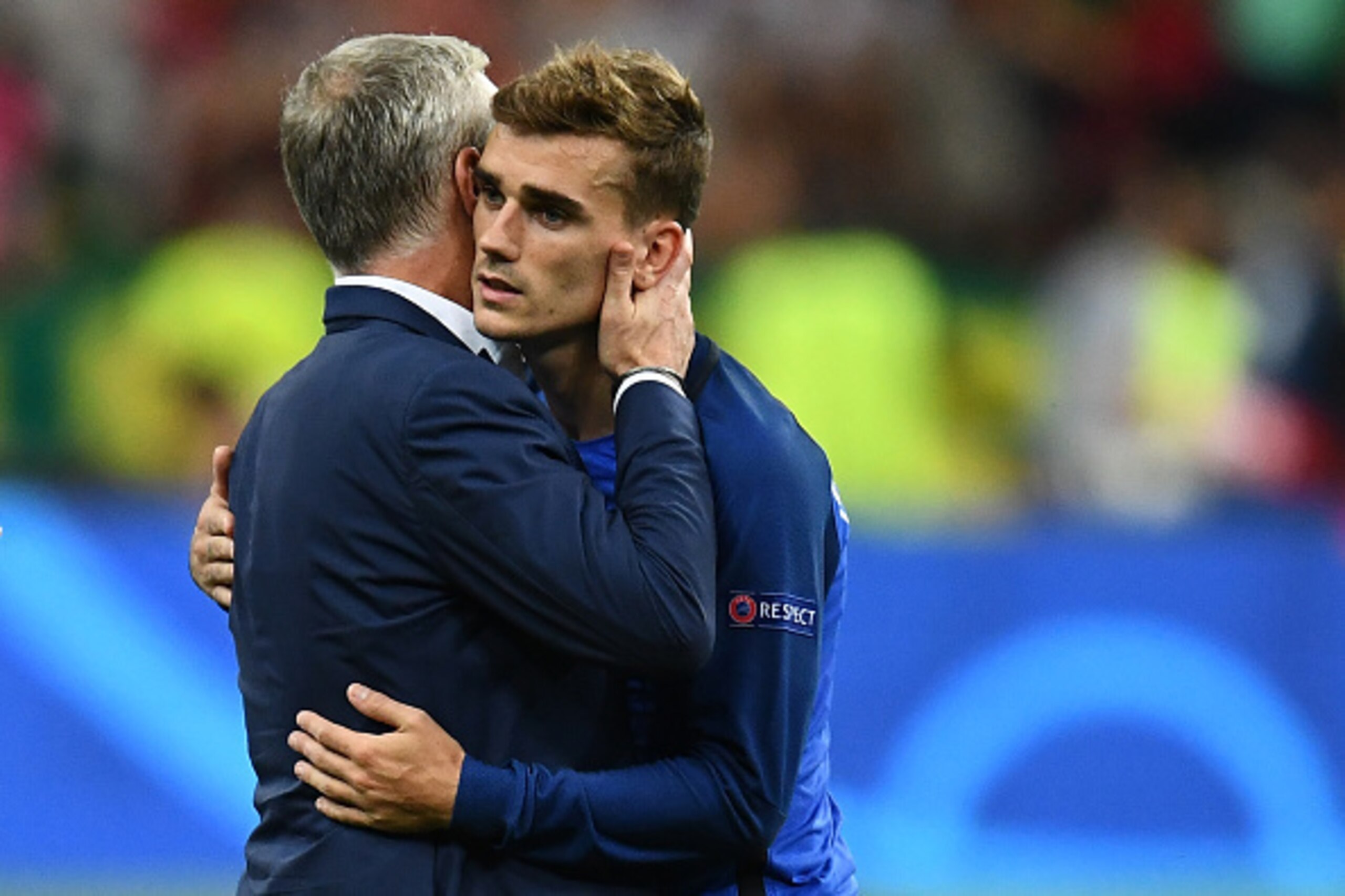 France's coach Didier Deschamps (L) consoles France's forward Antoine Griezmann after France lost 1-0 in the Euro 2016 final football match between France and Portugal at the Stade de France in Saint-Denis, north of Paris, on July 10, 2016. / AFP / FRANCK France's coach Didier Deschamps (L) consoles France's forward Antoine Griezmann after France lost 1-0 in the Euro 2016 final football match between France and Portugal at the Stade de France in Saint-Denis, north of Paris, on July 10, 2016. / AFP / FRANCK