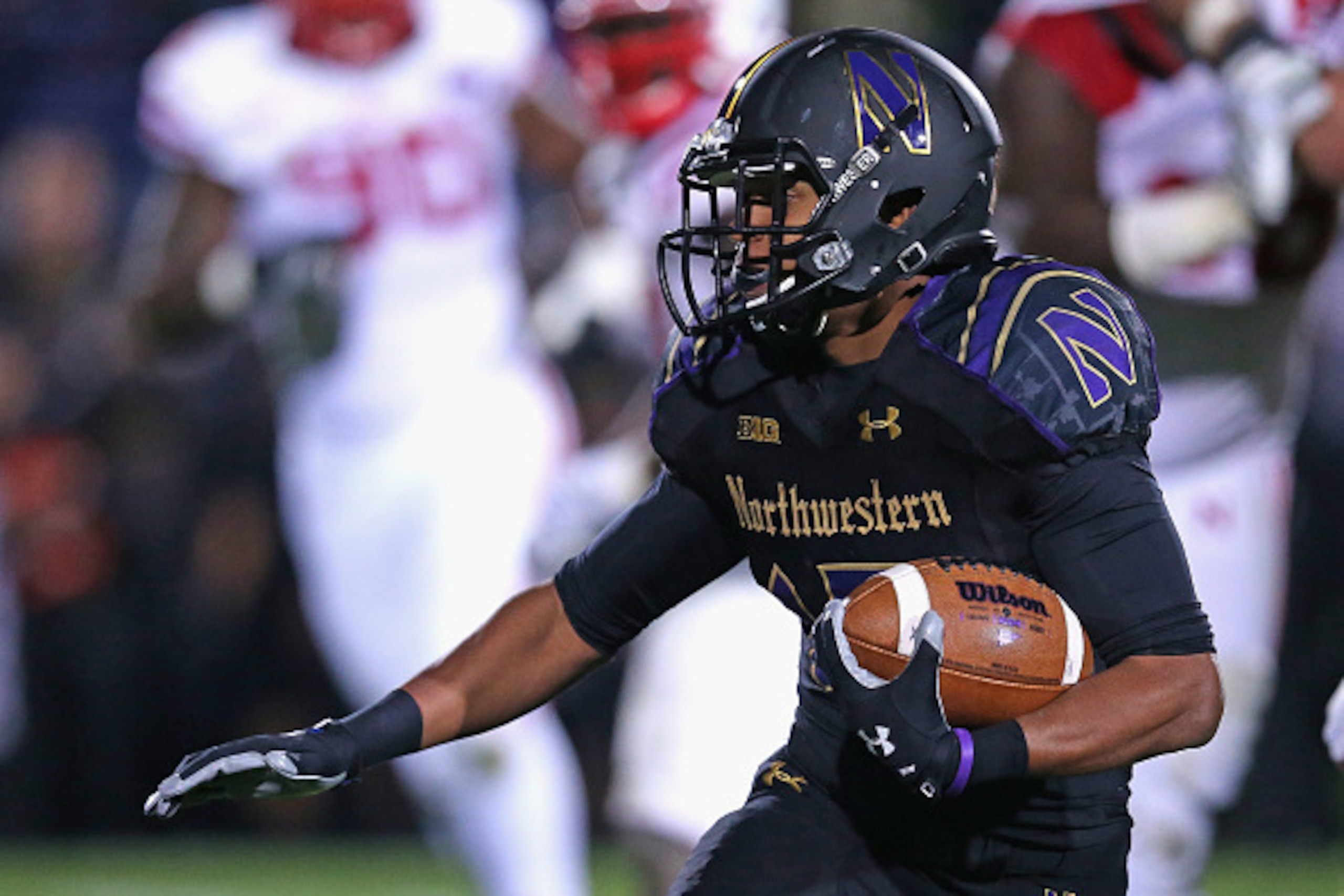 EVANSTON, IL - OCTOBER 18: Solomon Vault #15 of the Northwestern Wildcats runs against the Nebraska Cornhuskers at Ryan Field on October 18, 2014 in Evanston, Illinois. (Photo by Jonathan Daniel/Getty Images)