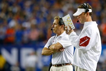 ATLANTA, GA - DECEMBER 5: Head coach Nick Saban of the Alabama Crimson Tide and offensive coordinator Lane Kiffin of the Alabama Crimson Tide look on against the Florida Gators in the third quarter during the SEC Championship at the Georgia Dome on Decemb