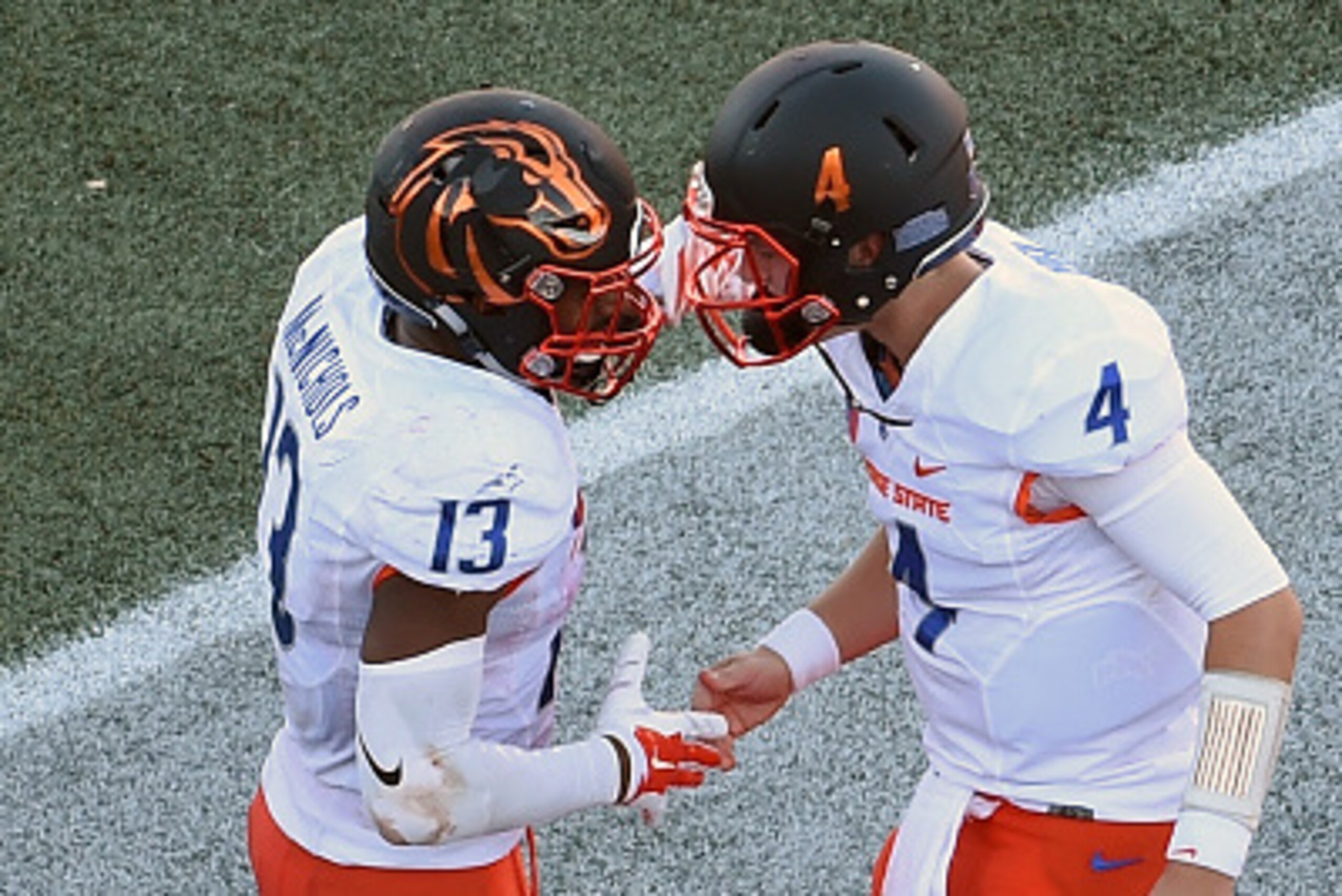 LAS VEGAS, NV - OCTOBER 31:  Running back Jeremy McNichols #13 is congratulated in the end zone by quarterback Brett Rypien #4 of the Boise State Broncos after McNichols ran for a 40-yard touchdown against the UNLV Rebels during their game at Sam Boyd Sta