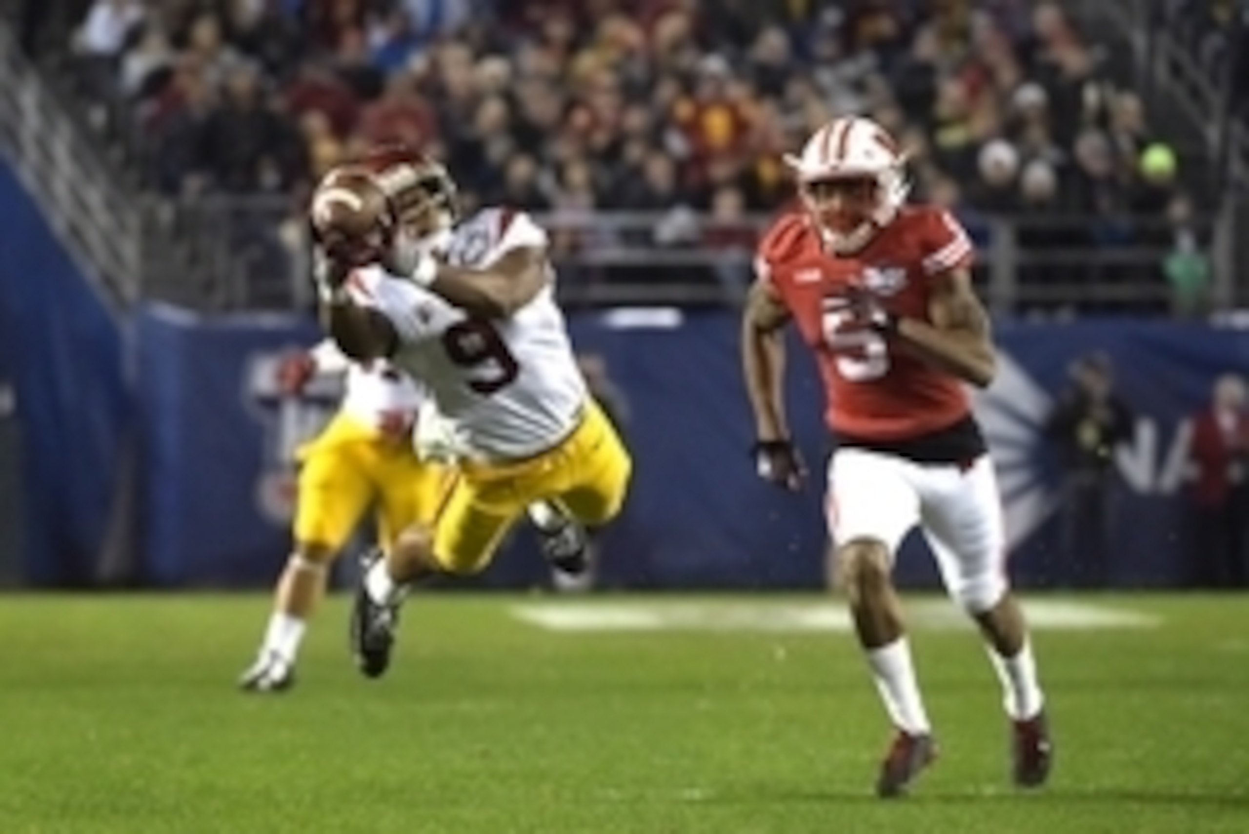 Dec 30, 2015; San Diego, CA, USA; Southern California Trojans wide receiver JuJu Smith-Schuster (9) attempts to catch a pass while defended by Wisconsin Badgers cornerback Darius Hillary (5) during the 2015 Holiday Bowl at Qualcomm Stadium. Mandatory Cred