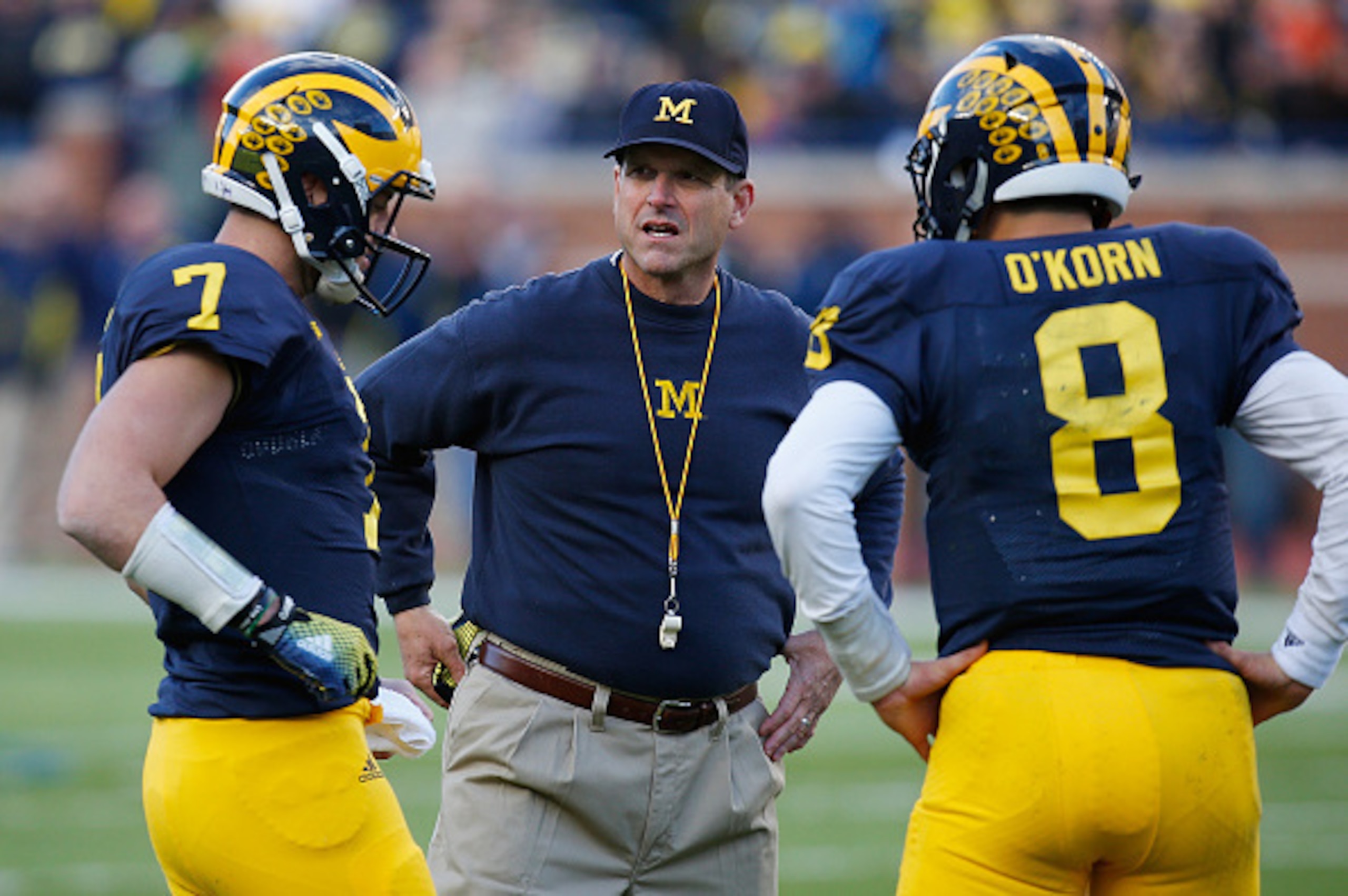 ANN ARBOR, MI - APRIL 01: Head coach Jim Harbaugh of the Michigan Wolverines talks with Shane Morris #7 and John O'Korn #8 during the Michigan spring game on April 1, 2016 at Michigan Stadium in Ann Arbor, Michigan.  (Photo by Gregory Shamus/Getty Images)