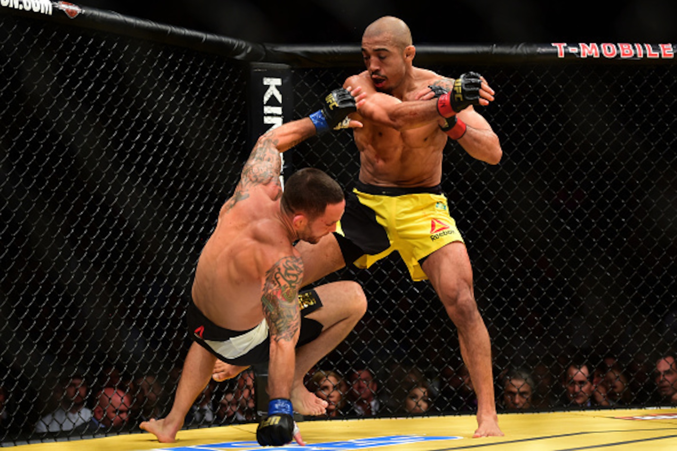 LAS VEGAS, NV - JULY 09: (R-L) Jose Aldo of Brazil punches Frankie Edgar in their UFC interim featherweight championship bout during the UFC 200 event on July 9, 2016 at T-Mobile Arena in Las Vegas, Nevada.  (Photo by Harry How/Zuffa LLC/Zuffa LLC via Get