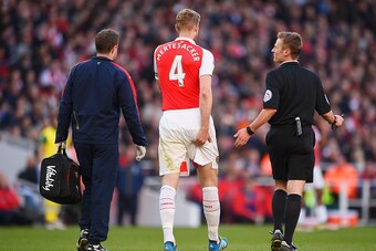 LONDON, ENGLAND - APRIL 30: Per Mertesacker of Arsenal leaves the field injured during the Barclays Premier League match between Arsenal and Norwich City at The Emirates Stadium on April 30, 2016 in London, England  (Photo by Mike Hewitt/Getty Images)