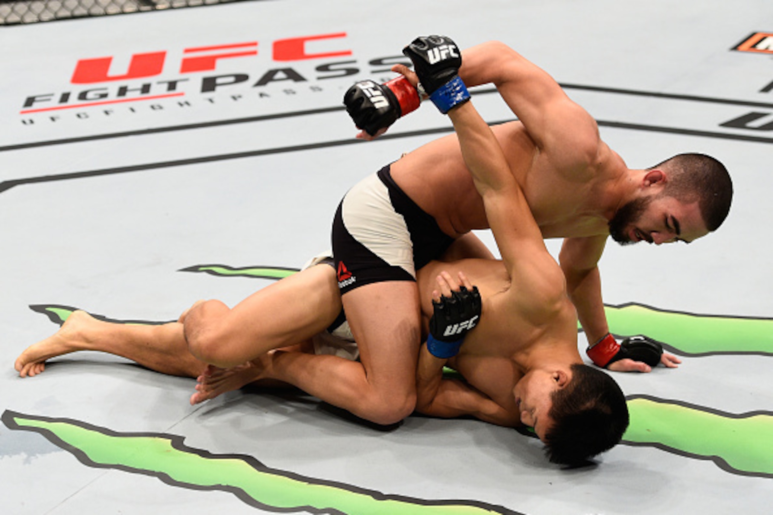 SIOUX FALLS, SD - JULY 13: Louis Smolka (top) punches Ben Nguyen in their flyweight bout during the UFC Fight Night event on July 13, 2016 at Denny Sanford Premier Center in Sioux Falls, South Dakota. (Photo by Jeff Bottari/Zuffa LLC/Zuffa LLC via Getty SIOUX FALLS, SD - JULY 13: Louis Smolka (top) punches Ben Nguyen in their flyweight bout during the UFC Fight Night event on July 13, 2016 at Denny Sanford Premier Center in Sioux Falls, South Dakota. (Photo by Jeff Bottari/Zuffa LLC/Zuffa LLC via Getty