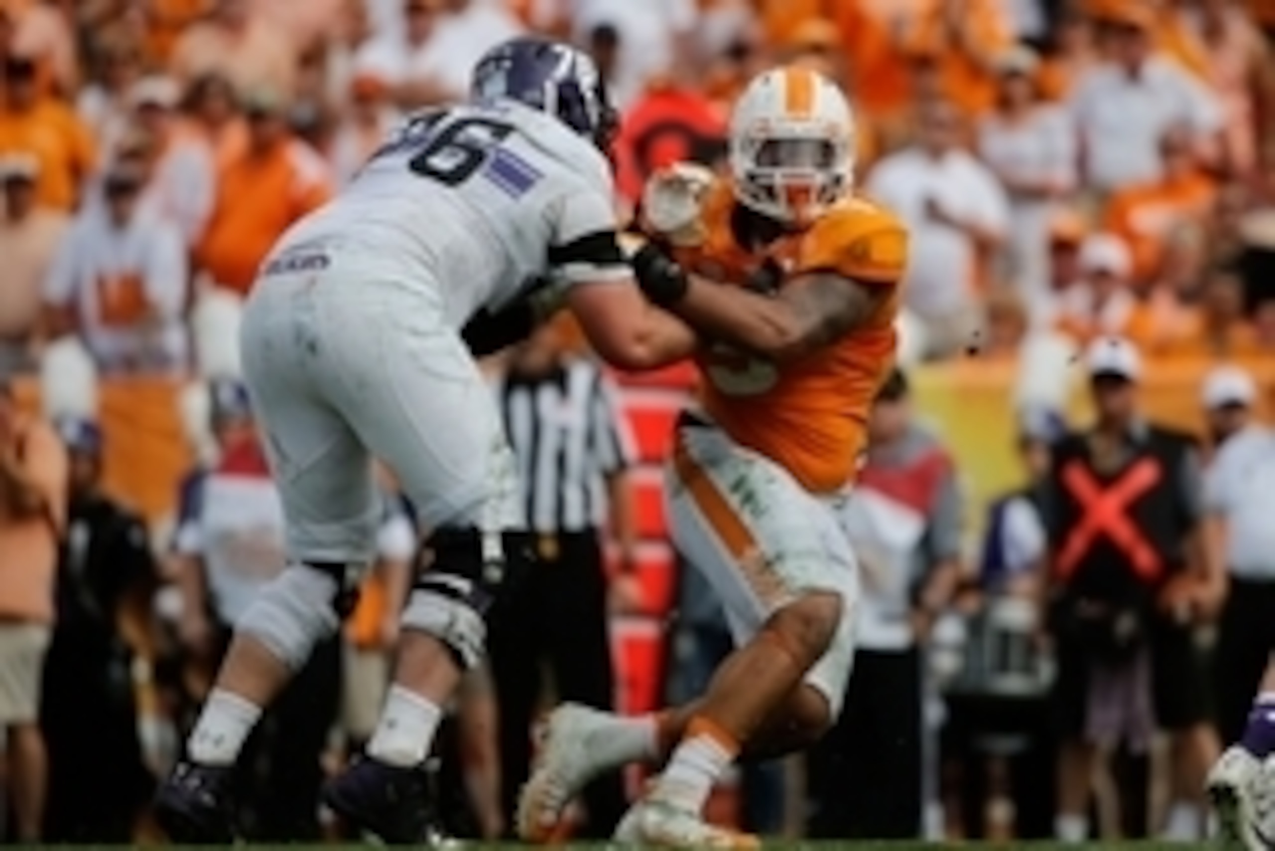 Jan 1, 2016; Tampa, FL, USA; Tennessee Volunteers defensive end Derek Barnett (9) rushes past Northwestern Wildcats offensive lineman Eric Olson (76) during the first half in the 2016 Outback Bowl at Raymond James Stadium. Mandatory Credit: Kim Klement-US