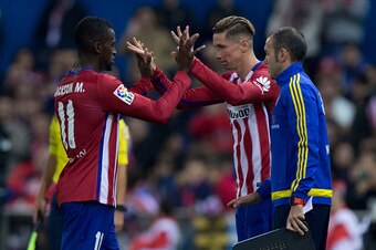 MADRID, SPAIN - OCTOBER 25: Jackson Arley Martinez  (L) of Atletico de Madrid clashes hands with Fernando Torres (R) as the first is relevated during the La Liga amtch between Club Atletico de Madrid and Valencia CF at Vicente Calderon Stadium on October 