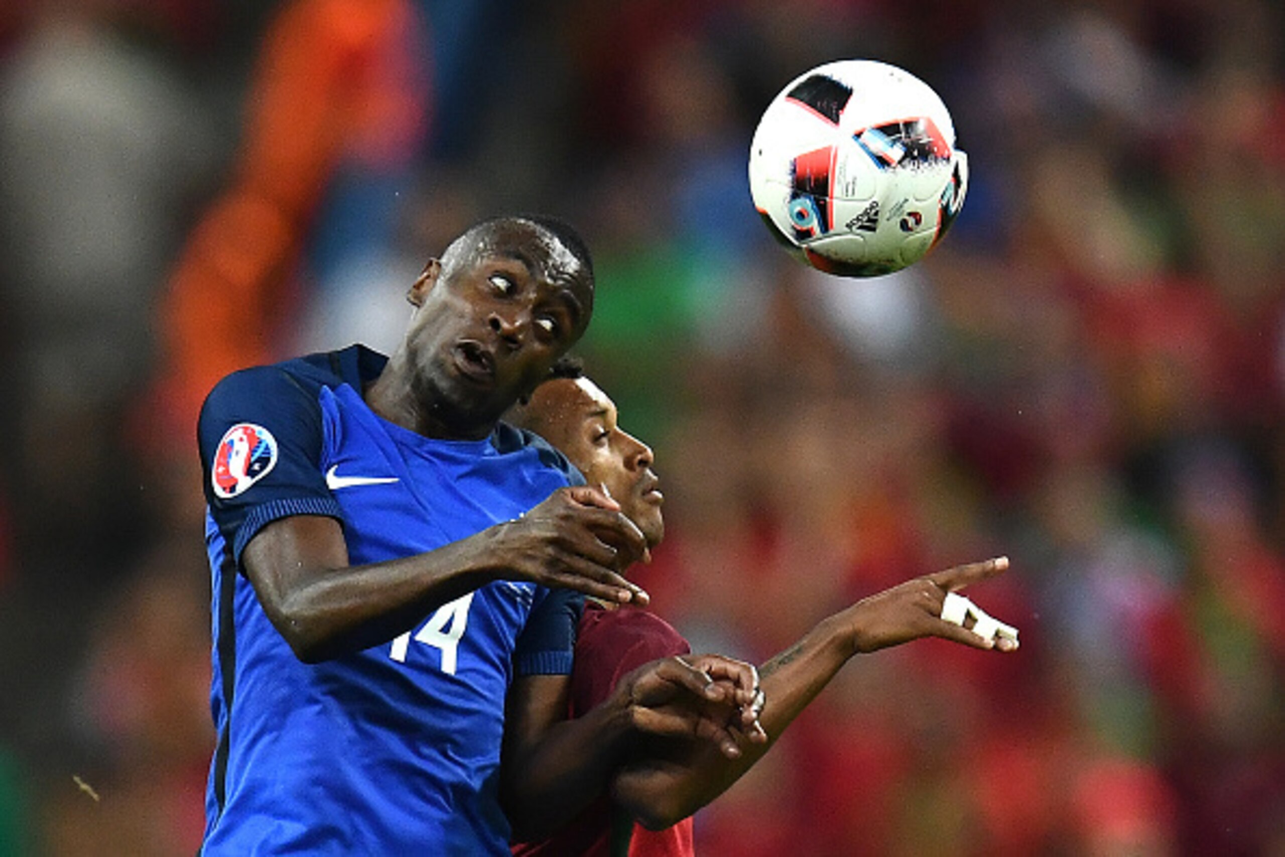 TOPSHOT - France's midfielder Blaise Matuidi (L) vies for the ball against Portugal's forward Nani during the Euro 2016 final football match between France and Portugal at the Stade de France in Saint-Denis, north of Paris, on July 10, 2016. / AFP / FRANC