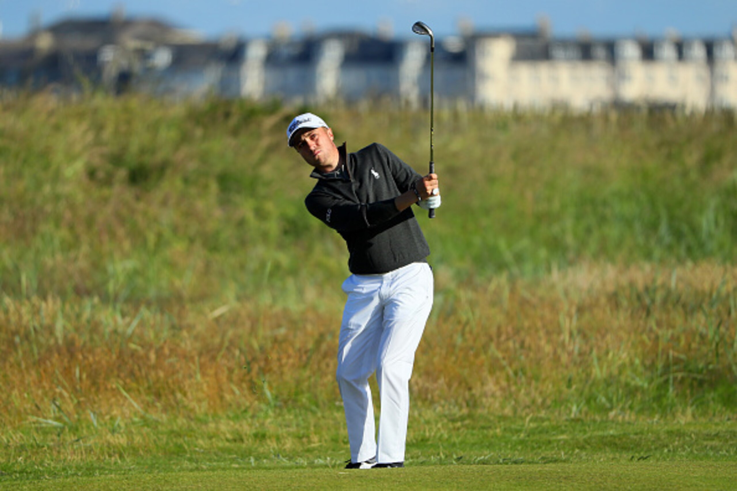 TROON, SCOTLAND - JULY 14:  Justin Thomas of the United States plays a shot on the 1st hole during the first round on day one of the 145th Open Championship at Royal Troon on July 14, 2016 in Troon, Scotland.  (Photo by Andrew Redington/Getty Images)