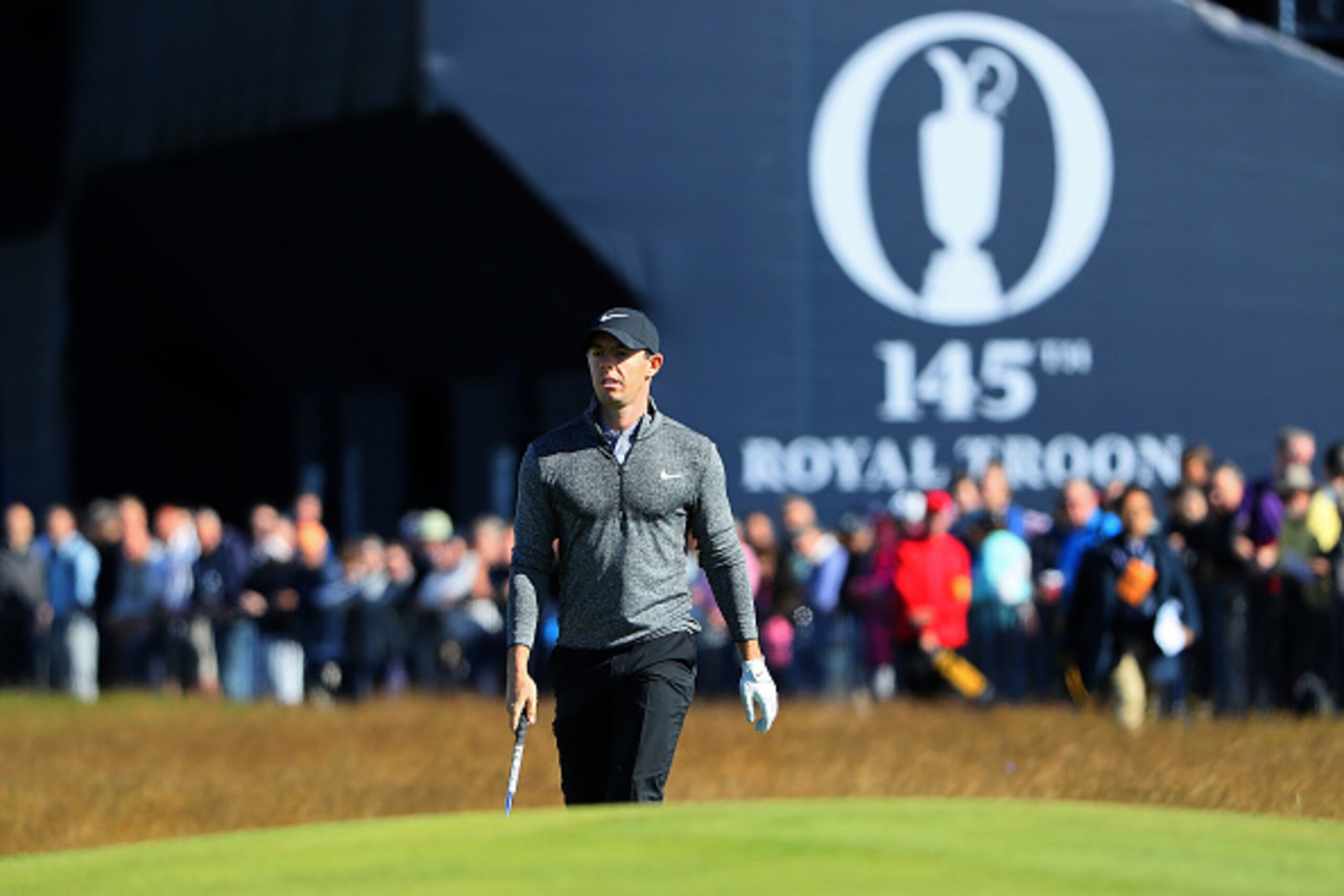 TROON, SCOTLAND - JULY 14:  Rory McIlroy of Northern Ireland walks on the 1st during the first round on day one of the 145th Open Championship at Royal Troon on July 14, 2016 in Troon, Scotland.  (Photo by Andrew Redington/Getty Images)