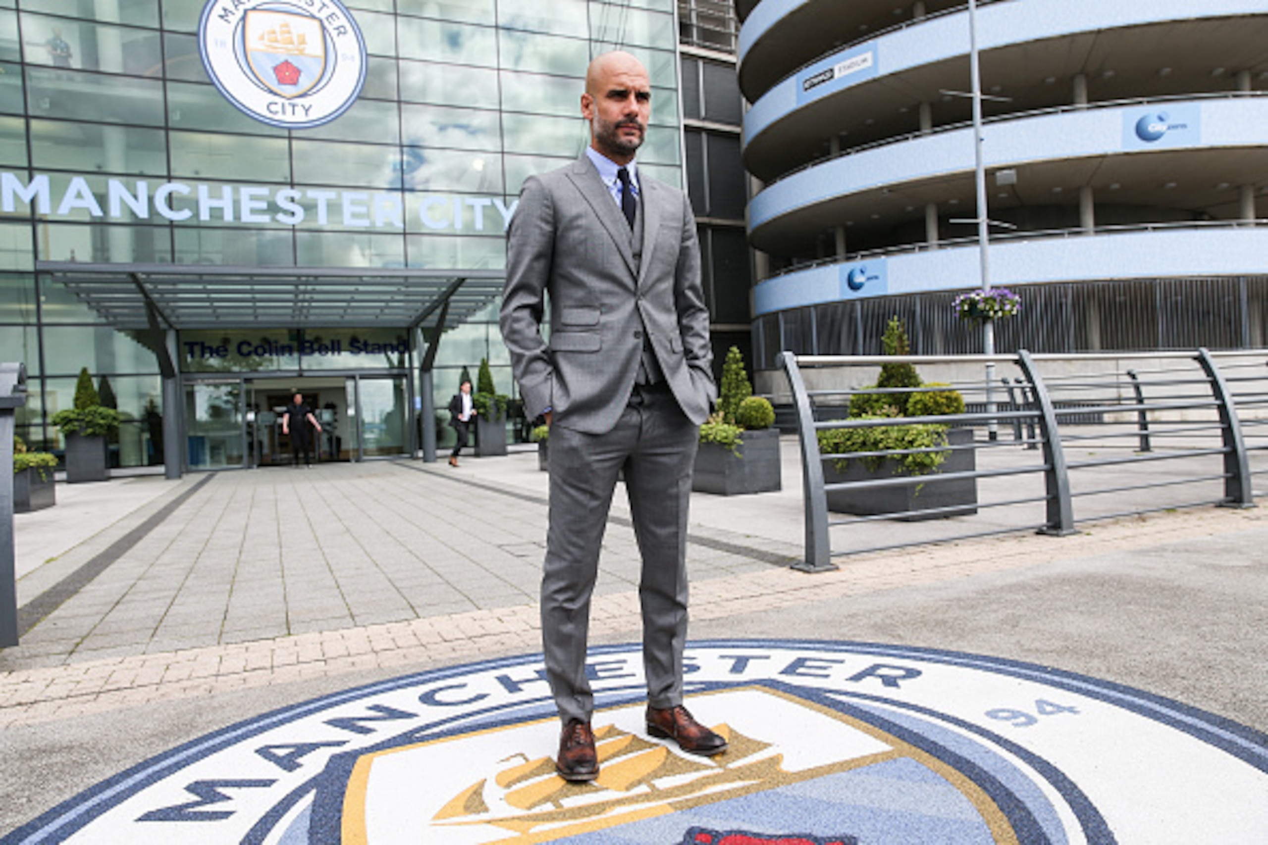 MANCHESTER, ENGLAND - JULY 08: Manchester City's manager Pep Guardiola poses for photographs outside the Etihad Stadium on July 8, 2016 in Manchester, England. (Photo by Barrington Coombs/Getty Images)