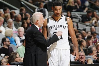 SAN ANTONIO, TX - DECEMBER 2:  Head coach Gregg Popovich of the San Antonio Spurs and Tim Duncan #21 of the San Antonio Spurs talk during the game against the Milwaukee Bucks on December 2, 2015 at the AT&T Center in San Antonio, Texas. NOTE TO USER: User