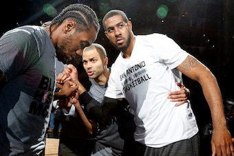SAN ANTONIO,TX - FEBRUARY 3: Kawhi Leonard #2 of the San Antonio Spurs,Tony Parker #9 of the San Antonio Spurs and LaMarcus Aldridge #12 of the San Antonio Spurs huddle before their game against the New Orleans Pelicans at AT&T Center on February 3, 2016 