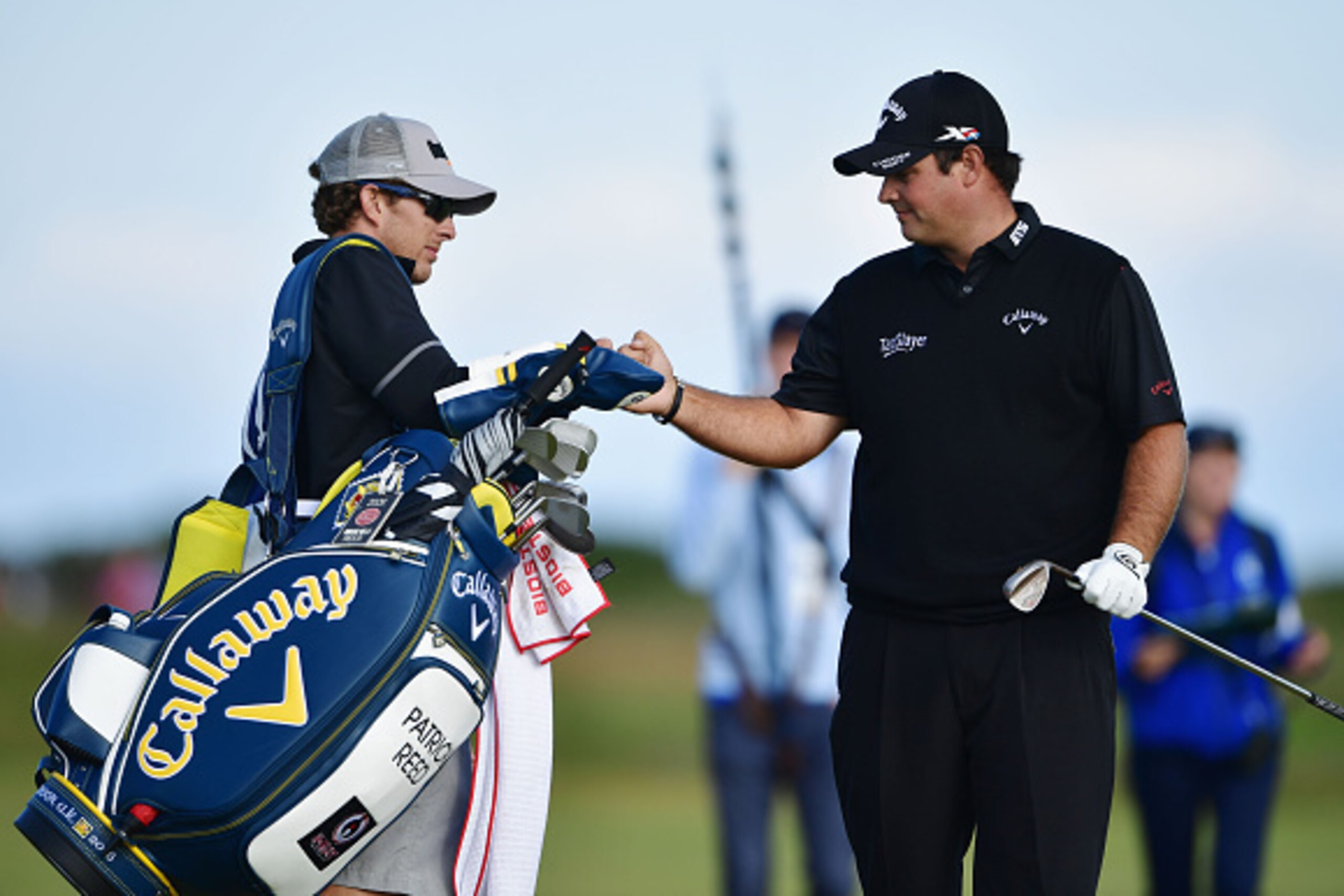 TROON, SCOTLAND - JULY 14: Patrick Reed of the United States celebrates with his caddie as he hits an eagle on the 3rd hole during the first round on day one of the 145th Open Championship at Royal Troon on July 14, 2016 in Troon, Scotland. (Photo by St TROON, SCOTLAND - JULY 14: Patrick Reed of the United States celebrates with his caddie as he hits an eagle on the 3rd hole during the first round on day one of the 145th Open Championship at Royal Troon on July 14, 2016 in Troon, Scotland. (Photo by St