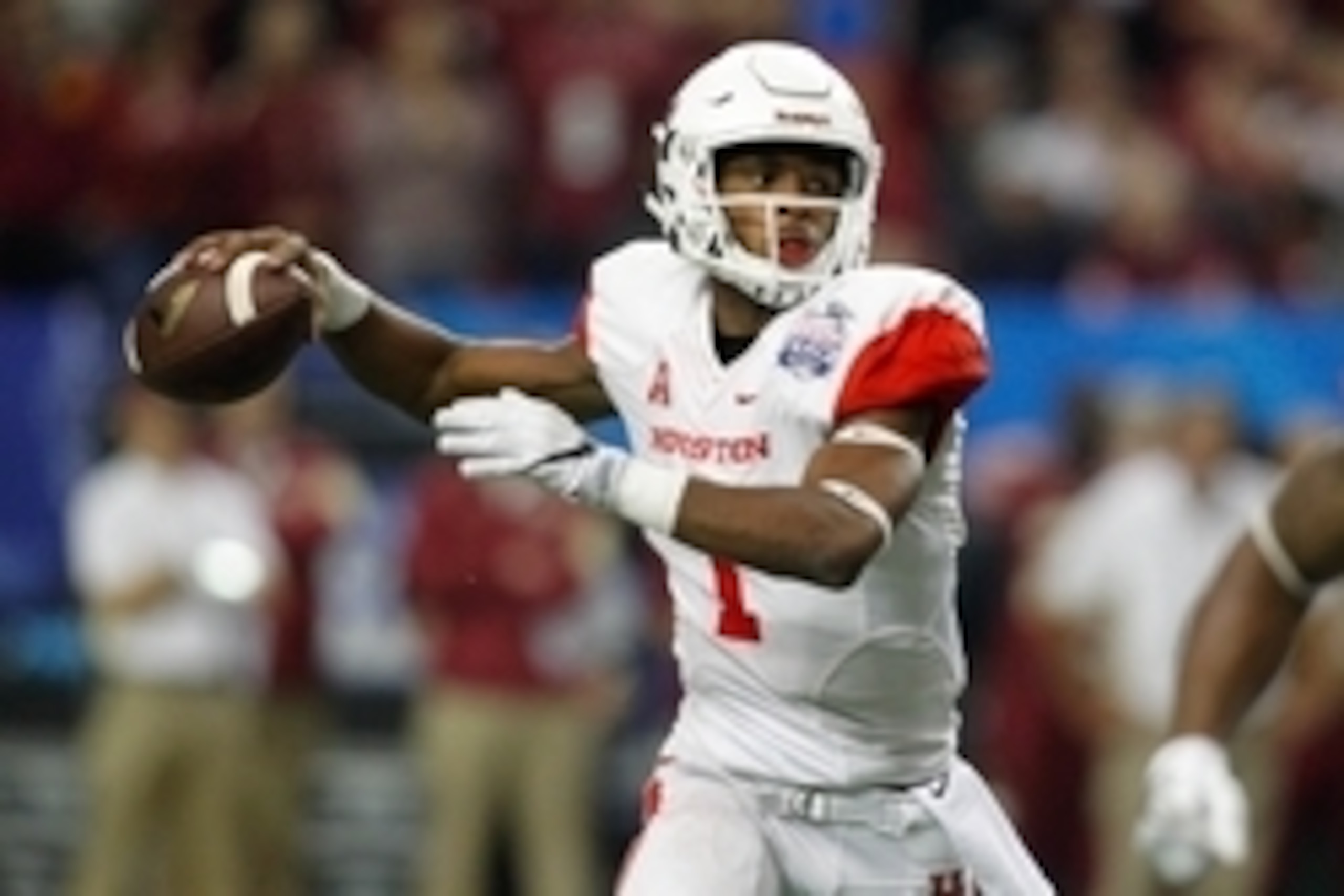 Dec 31, 2015; Atlanta, GA, USA; Houston Cougars quarterback Greg Ward Jr. (1) throws a pass against the Florida State Seminoles in the fourth quarter in the 2015 Chick-fil-A Peach Bowl at the Georgia Dome. Houston defeated Florida State 38-24. Mandatory C