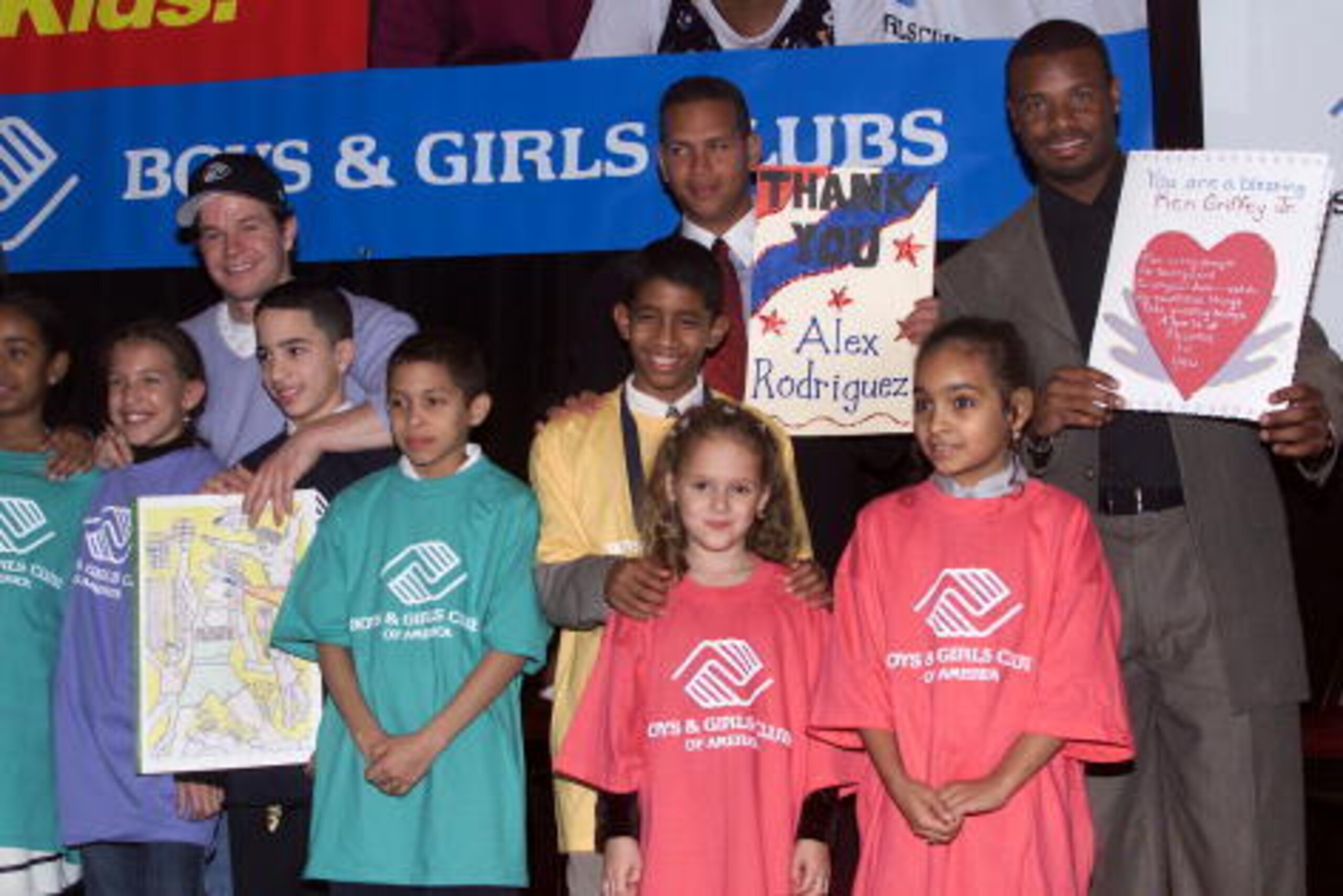 (l to r) Mark Wahlberg, Texas Rangers shortstop Alex Rodriguez, and Reds centerfielder Ken Griffey, Jr. with members of the Boys & Girls Club at the launch of 'Campaign 3 P.M.' at the Waldorf-Astoria Hotel in New York City.  The campaign is part of the Bo