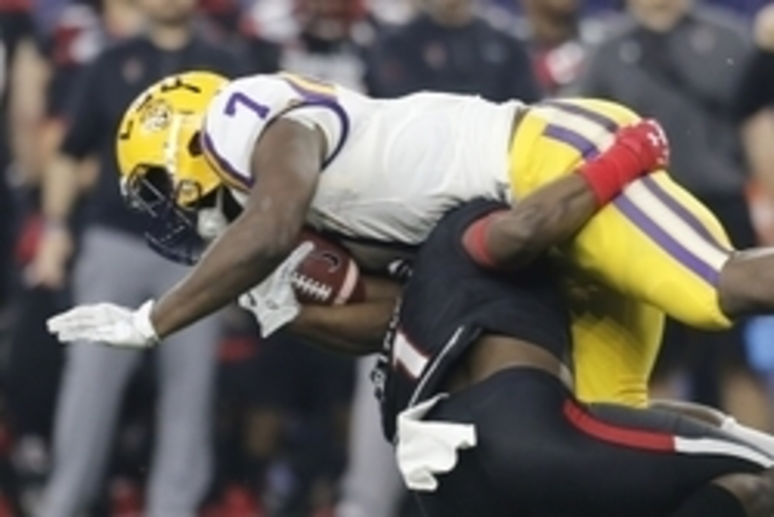 Dec 29, 2015; Houston, TX, USA; LSU Tigers running back Leonard Fournette (7) is tackled by Texas Tech Red Raiders defensive back Nigel Bethel (1) in the second quarter at NRG Stadium. Mandatory Credit: Thomas B. Shea-USA TODAY Sports Dec 29, 2015; Houston, TX, USA; LSU Tigers running back Leonard Fournette (7) is tackled by Texas Tech Red Raiders defensive back Nigel Bethel (1) in the second quarter at NRG Stadium. Mandatory Credit: Thomas B. Shea-USA TODAY Sports