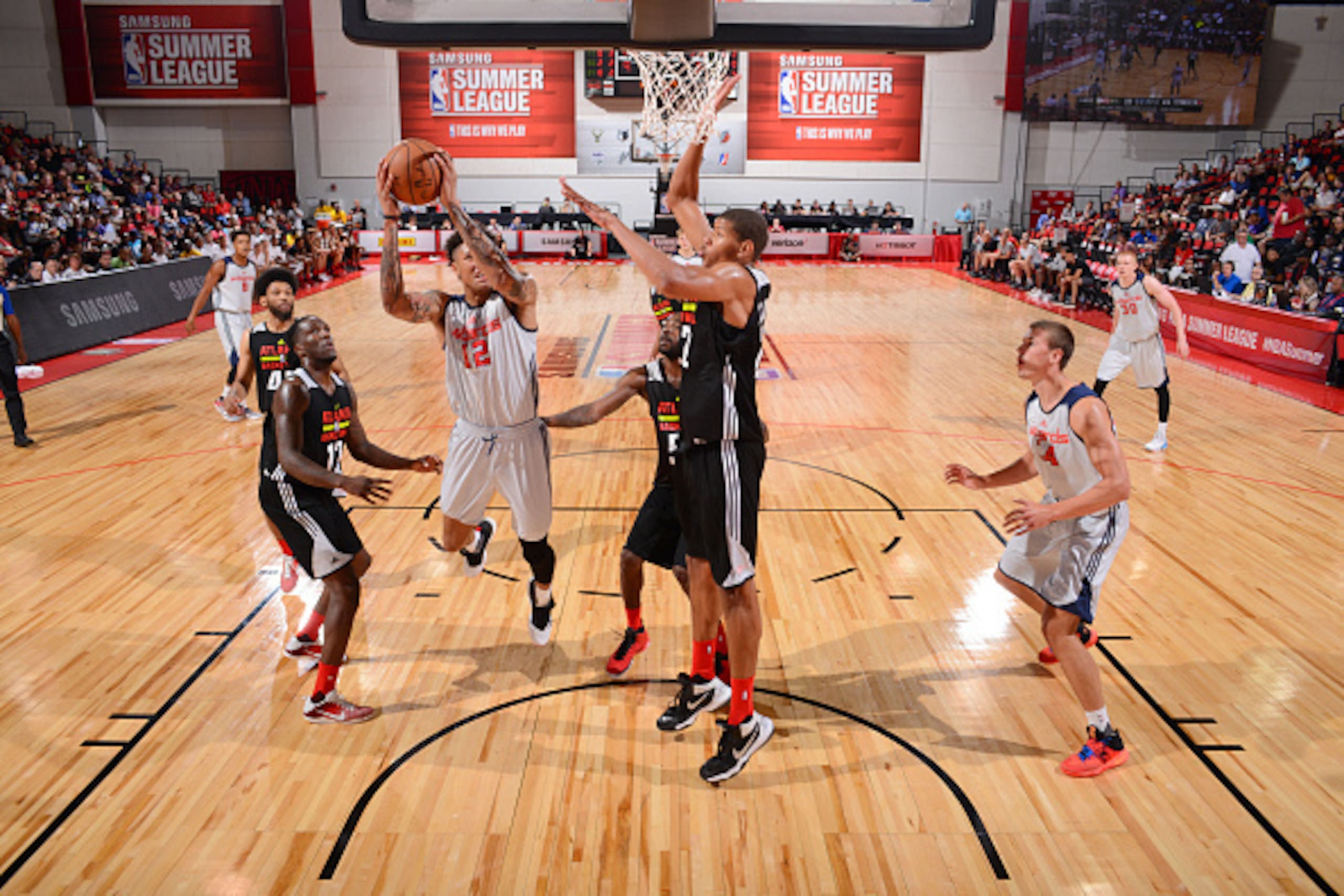 LAS VEGAS, NV - JULY 14:  Kelly Oubre Jr. #12 of the Washington Wizards shoots the ball against the Atlanta Hawks during the 2016 NBA Las Vegas Summer League game on July 14, 2016 at the Cox Pavillion in Las Vegas, Nevada. NOTE TO USER: User expressly ack