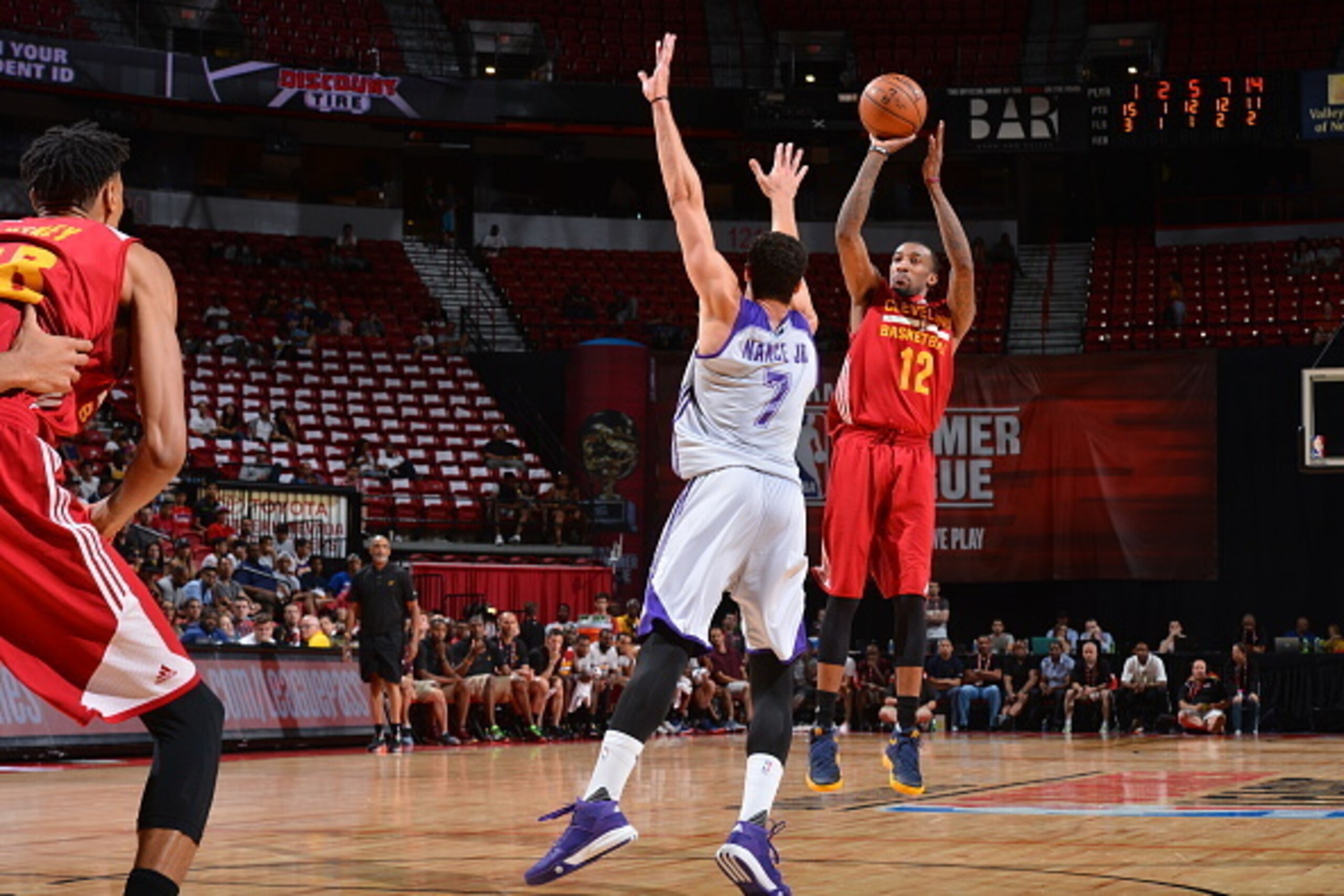 LAS VEGAS, NV - JULY 14:  Jordan McRae #12 of the Cleveland Cavaliers shoots against Larry Nance Jr #7 of the Los Angeles Lakers during the 2016 NBA Las Vegas Summer League game on July 14, 2016 at The Thomas & Mack Center in Las Vegas, Nevada. NOTE TO US
