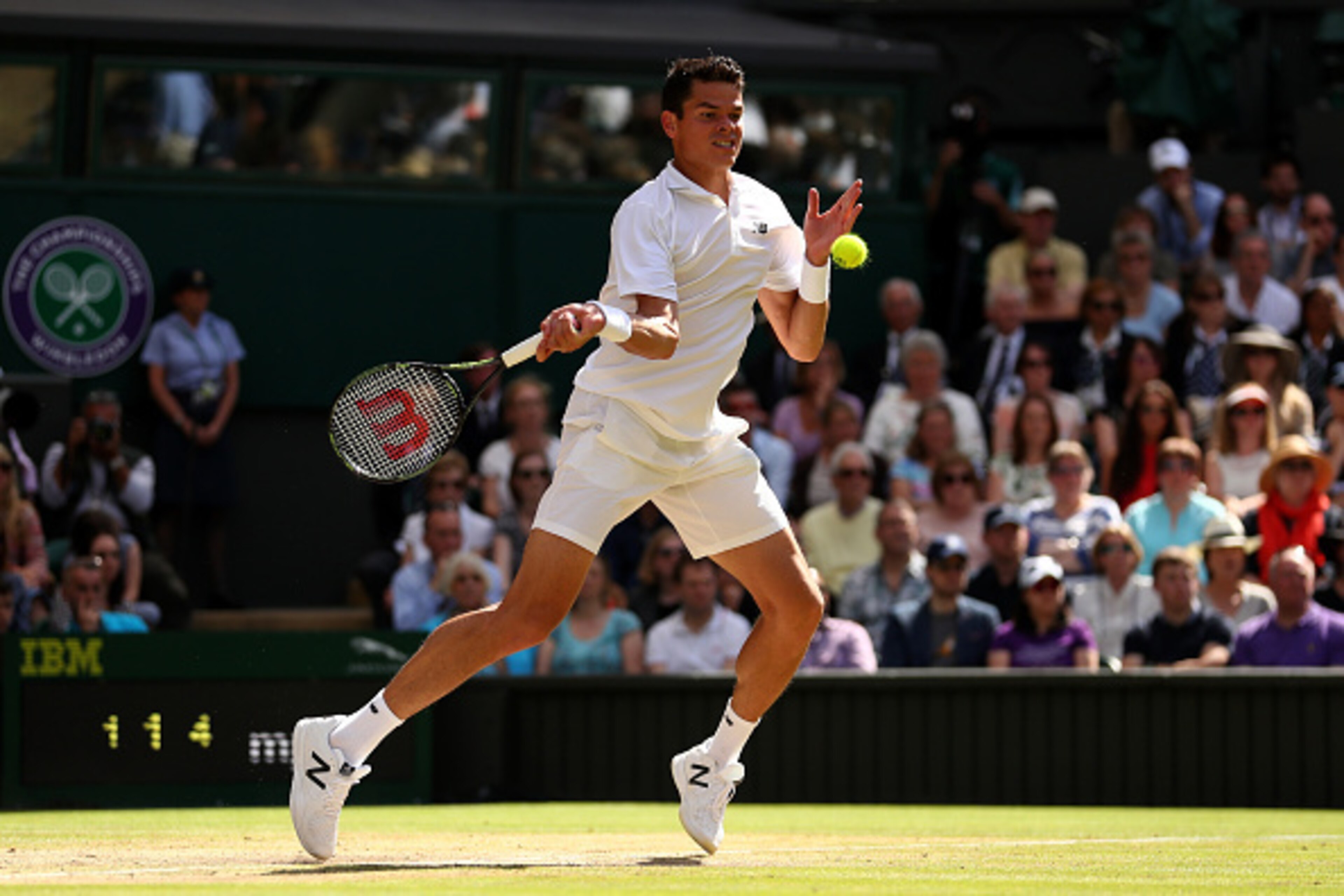 LONDON, ENGLAND - JULY 10: Milos Raonic of Canada plays a backhand during the Men's Singles Final against Andy Murray of Great Britain on day thirteen of the Wimbledon Lawn Tennis Championships at the All England Lawn Tennis and Croquet Club on July 10, LONDON, ENGLAND - JULY 10: Milos Raonic of Canada plays a backhand during the Men's Singles Final against Andy Murray of Great Britain on day thirteen of the Wimbledon Lawn Tennis Championships at the All England Lawn Tennis and Croquet Club on July 10,