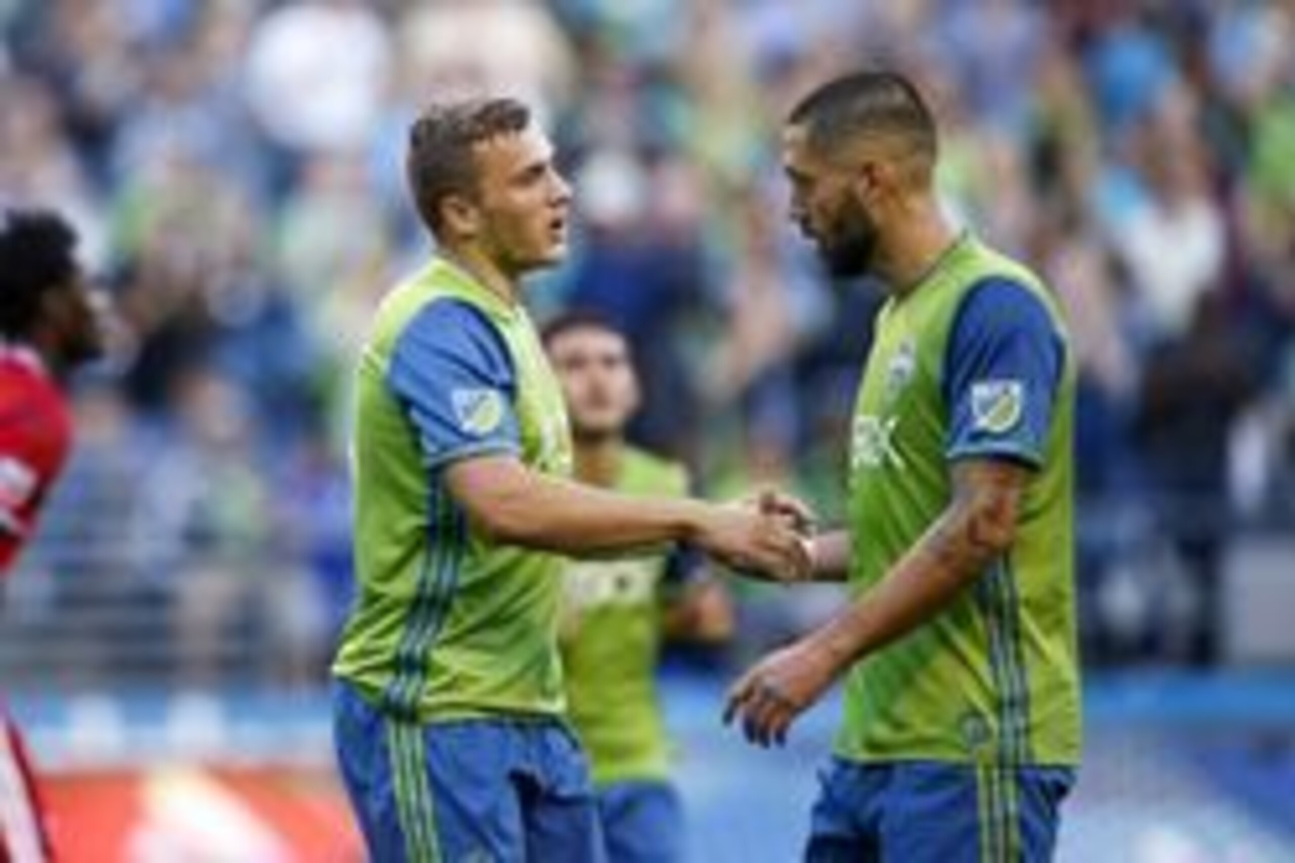Jul 13, 2016; Seattle, WA, USA; Seattle Sounders FC forward Jordan Morris (13) celebrates with midfielder Clint Dempsey (2) after scoring a goal against the FC Dallas during the first half at CenturyLink Field. Seattle defeated Dallas 5-0. Mandatory Credi