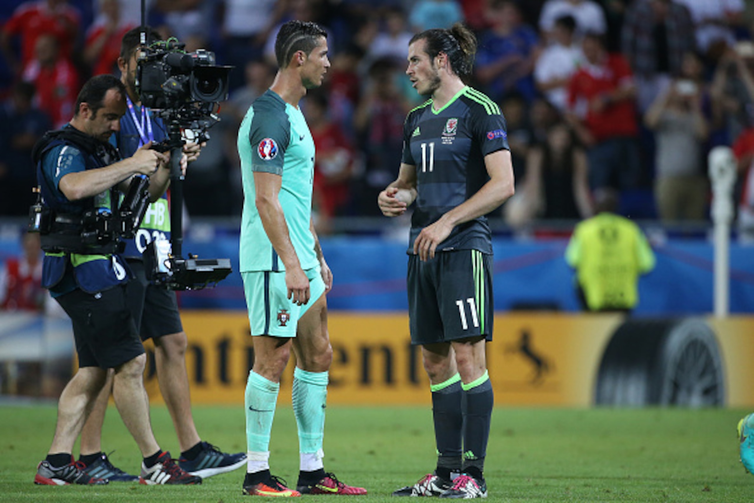 LYON, FRANCE - JULY 6: Cristiano Ronaldo of Portugal greets Gareth Bale of Wales following the UEFA Euro 2016 semi-final between Wales and Portugal at Parc OL, Stade des Lumieres on July 6, 2016 in Lyon, France. (Photo by Jean Catuffe/Getty Images)