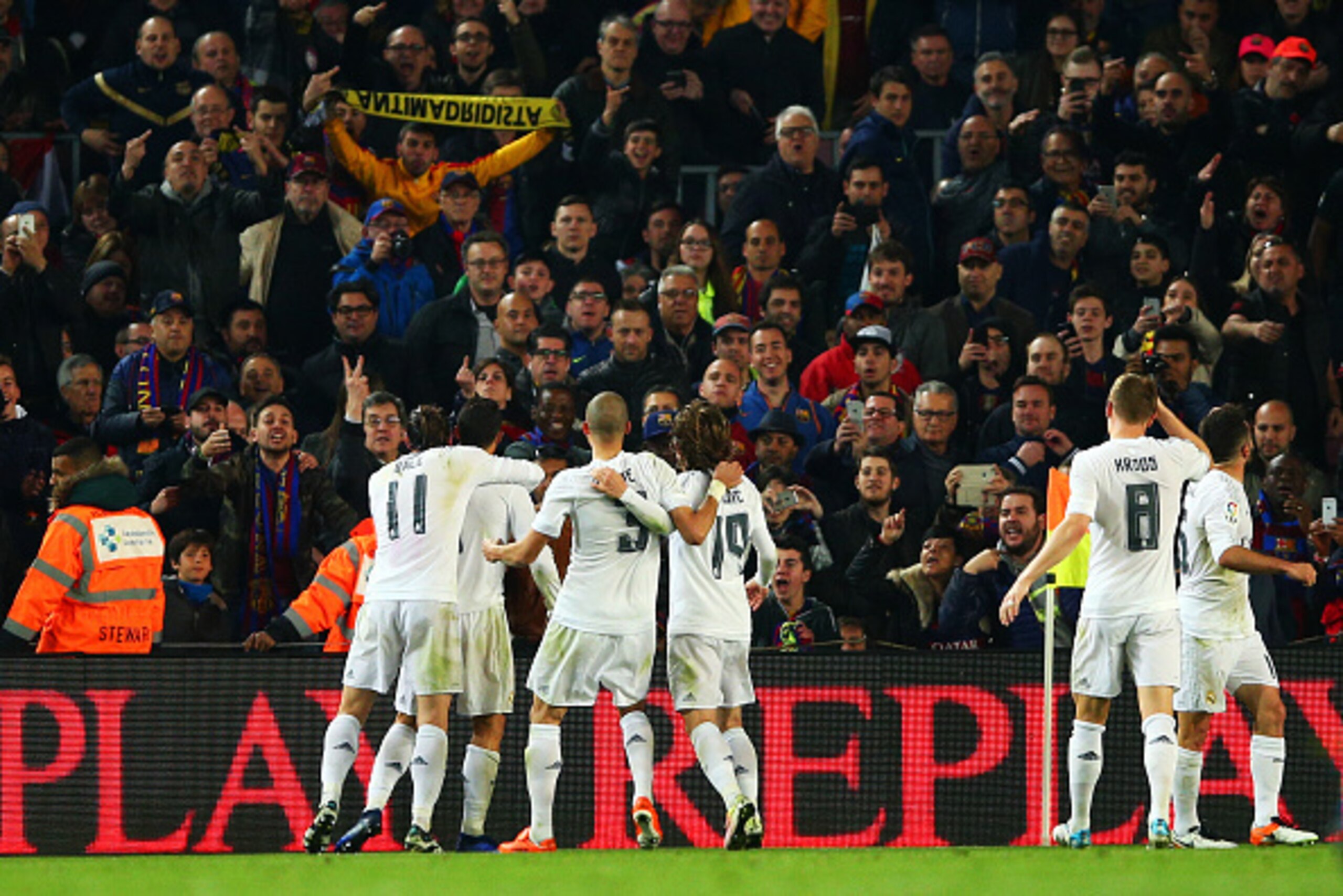 BARCELONA, SPAIN - APRIL 02:  Cristiano Ronaldo of Real Madrid CF celebrates with team-mates after scoring their second goal during the La Liga match between FC Barcelona and Real Madrid CF at Camp Nou on April 2, 2016 in Barcelona, Spain.  (Photo by Paul