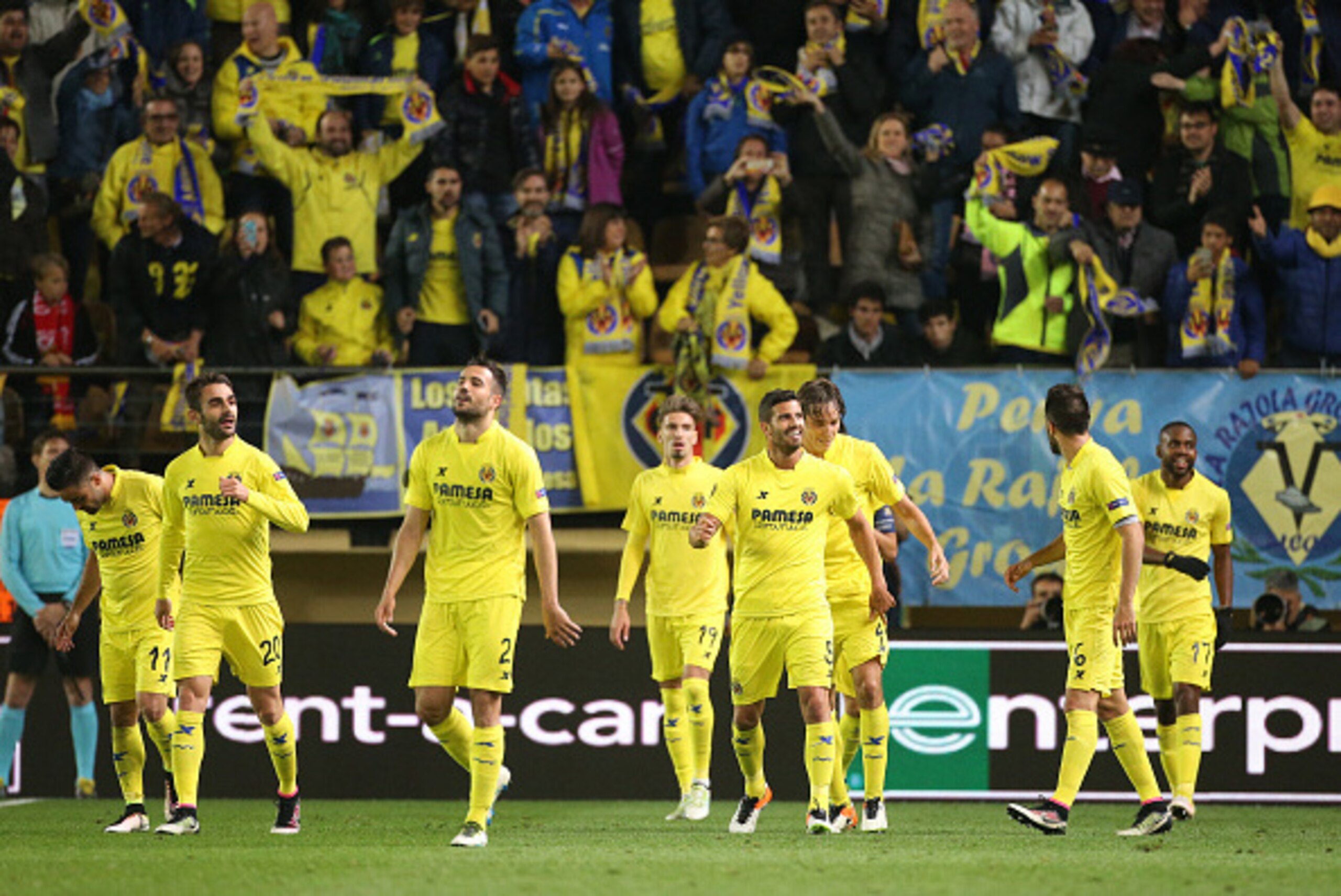 VILLARREAL, SPAIN - APRIL 28: Villarreal players celebrate with fans as Adrian Lopez of Villarreal scores the first goal during the UEFA Europa League semi final first leg match between Villarreal CF and Liverpool FC at Estadio El Madrigal stadium on Apri
