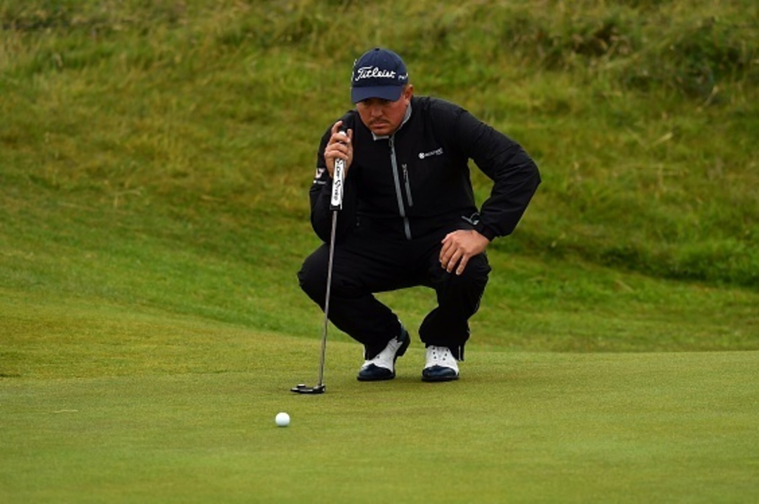 US golfer Jason Dufner lines up a putt on the 15th green during his second round on day two of the 2016 British Open Golf Championship at Royal Troon in Scotland on July 15, 2016.
The second round got underway on Friday morning, with expectations for far 