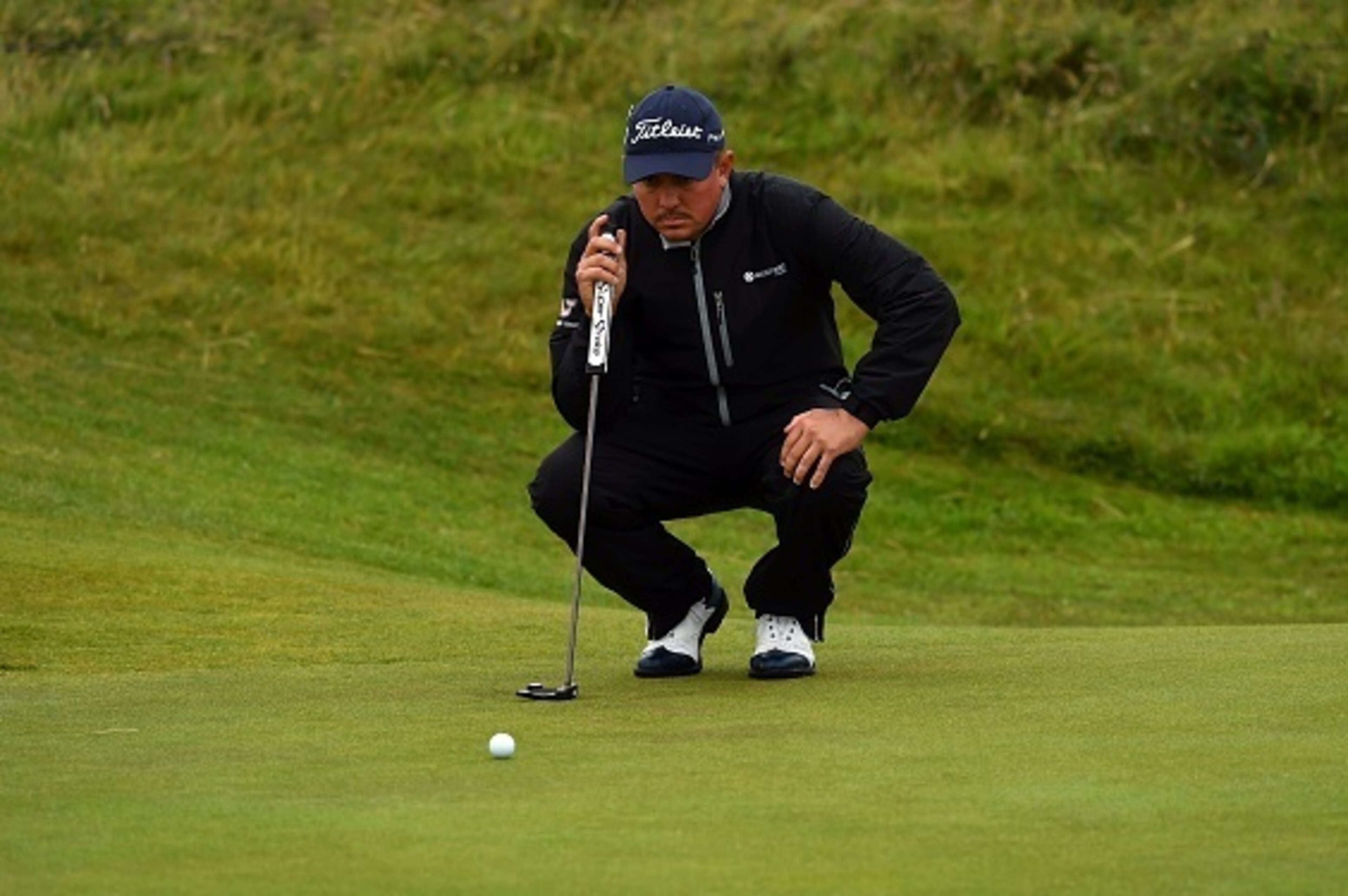 US golfer Jason Dufner lines up a putt on the 15th green during his second round on day two of the 2016 British Open Golf Championship at Royal Troon in Scotland on July 15, 2016.
The second round got underway on Friday morning, with expectations for far 