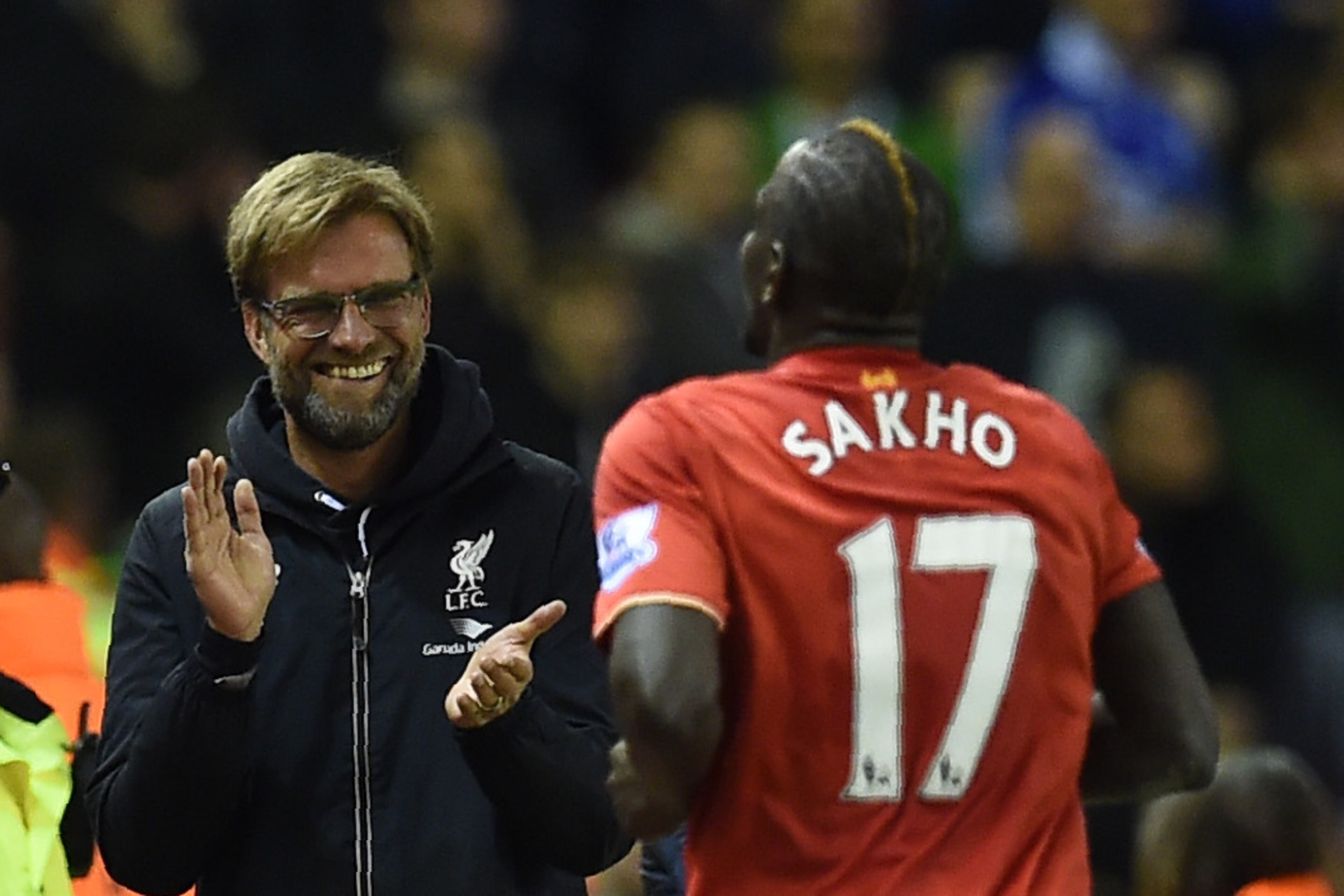 Liverpool's French defender Mamadou Sakho (R) celebrates with Liverpool's German manager Jurgen Klopp after scoring during the English Premier League football match between Liverpool and Everton at Anfield in Liverpool, north west England on April 20, 201
