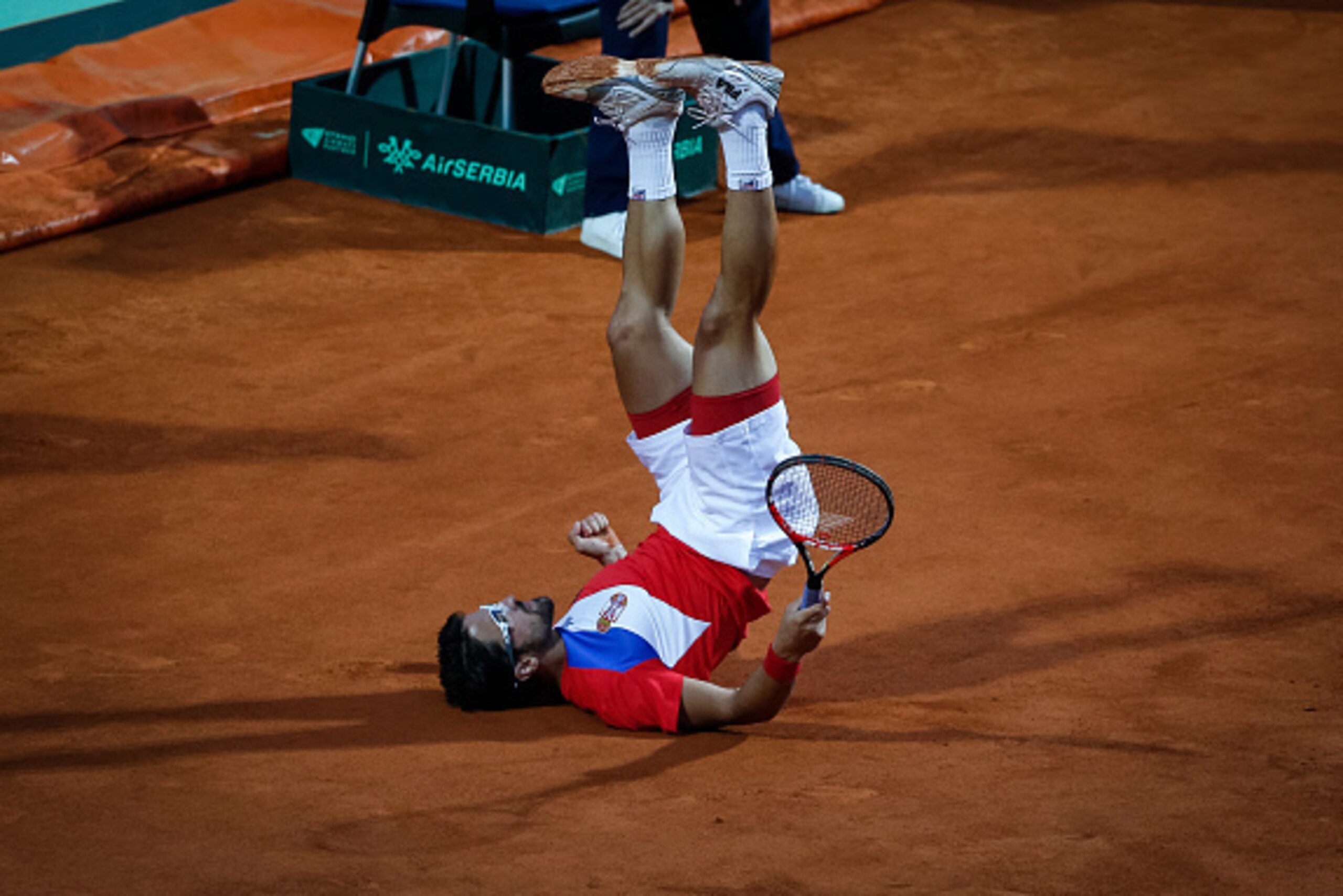BELGRADE, SERBIA - JULY 15: Janko Tipsarevic of Serbia takes a tumble during the Davis Cup Quarter Final match between Serbia and Great Britain on Stadium Tasmajdan on July 15, 2016 in Belgrade, Serbia. (Photo by Srdjan Stevanovic/Getty Images)