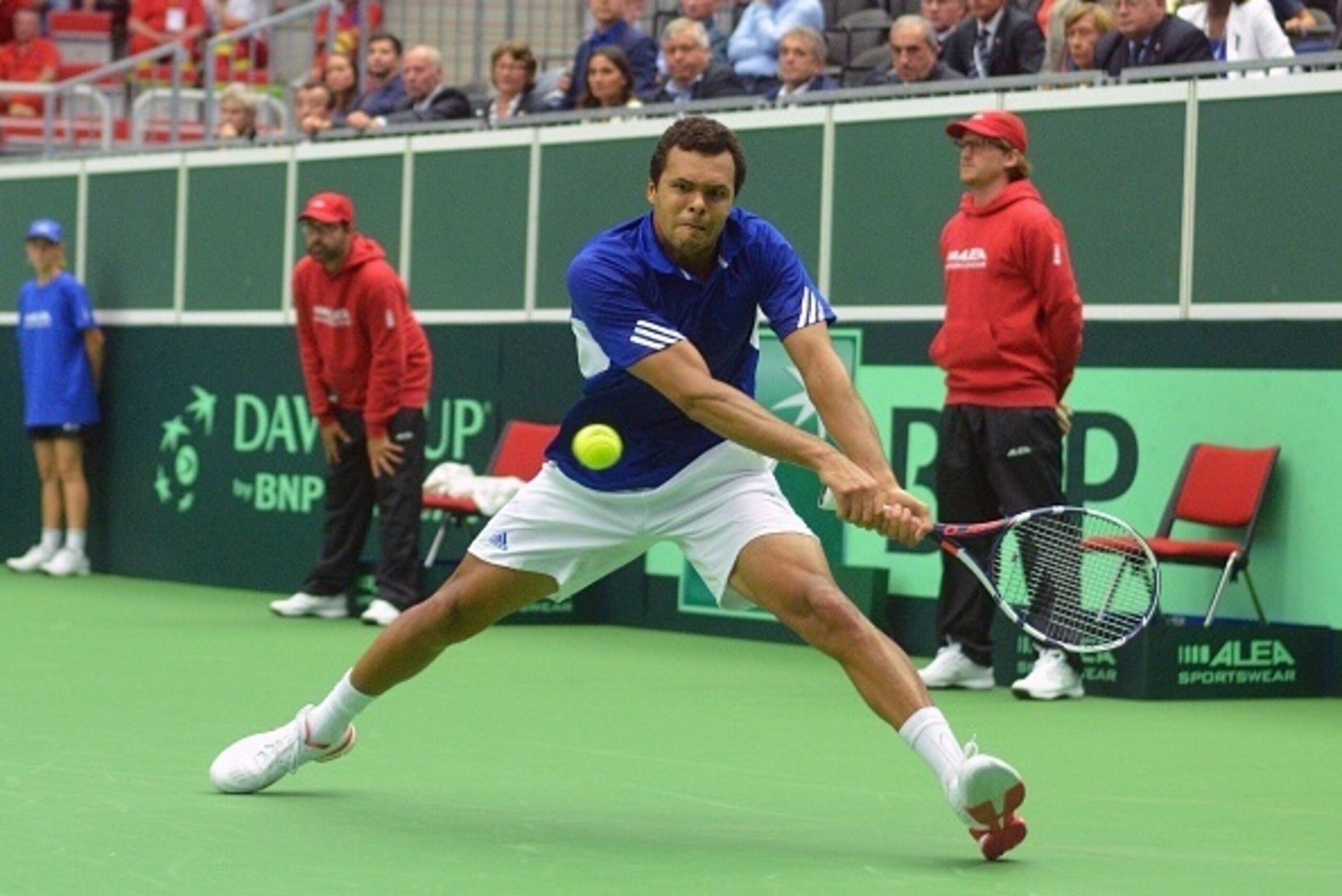 Jo-Wilfried Tsonga of France returns the ball to Lukas Rosol of the Czech Republic during the Davis Cup quarter-final Tennis match on July 15, 2016 in Trinec. / AFP / Michal Cizek        (Photo credit should read MICHAL CIZEK/AFP/Getty Images)