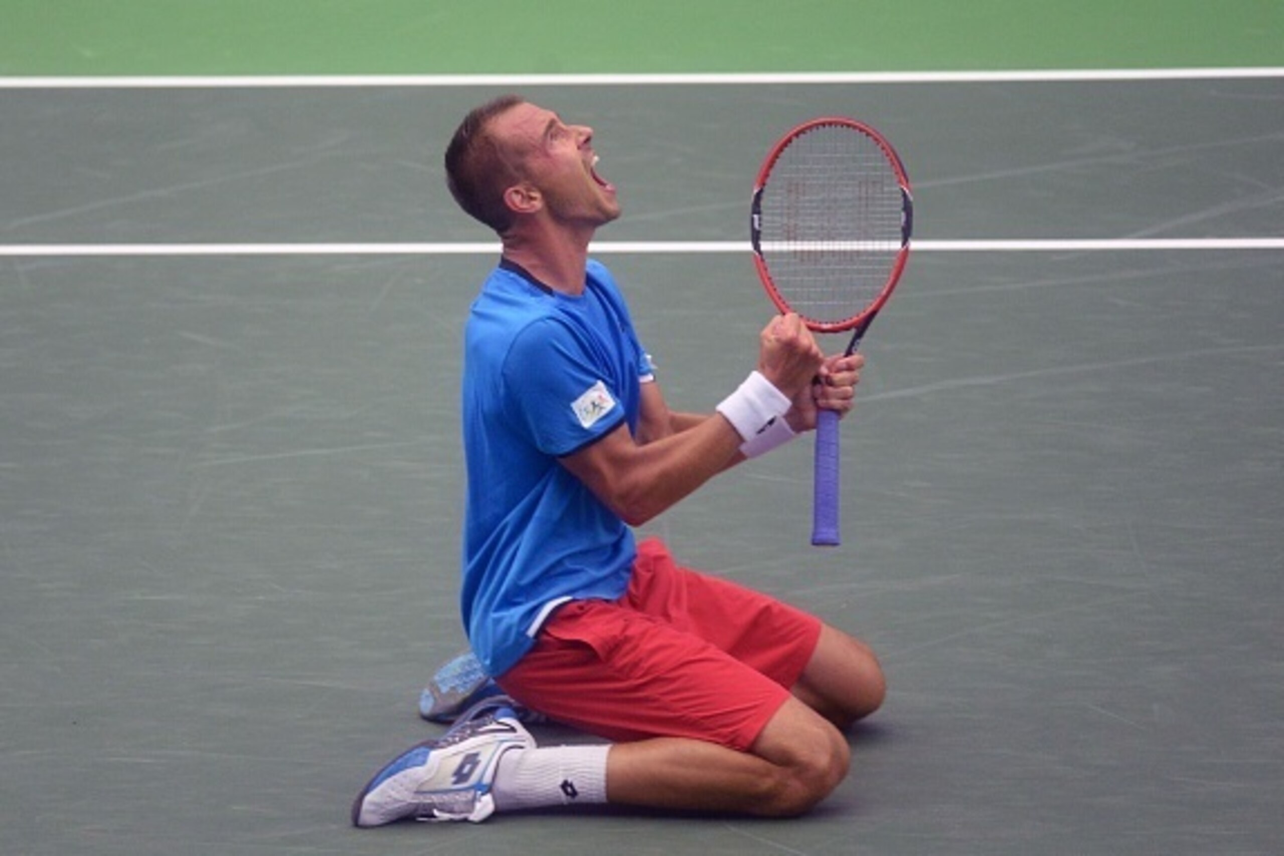 Lukas Rosol of the Czech Republic celebrates victory over Jo-Wilfried Tsonga of France during the Davis Cup quarter-final Tennis match on July 15, 2016 in Trinec.  / AFP / Michal Cizek        (Photo credit should read MICHAL CIZEK/AFP/Getty Images)