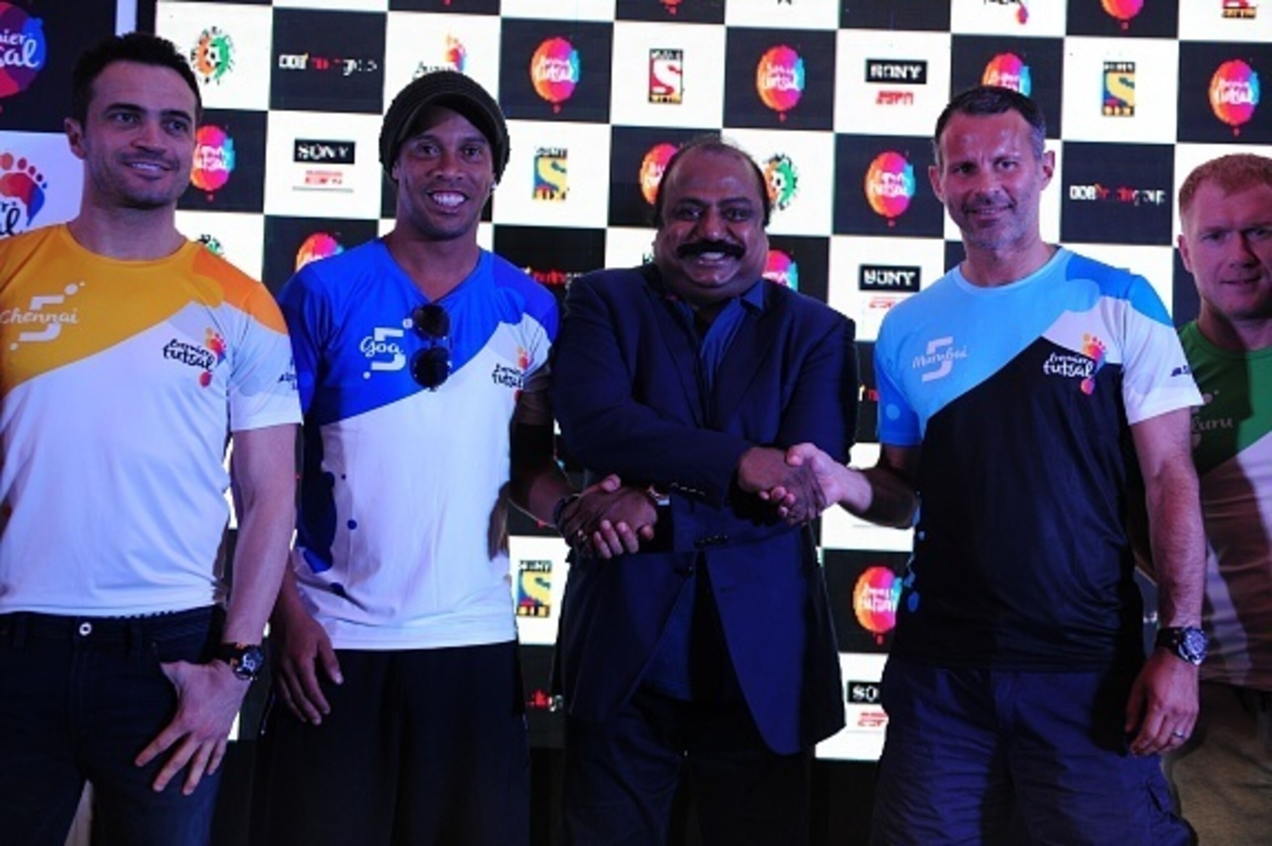 Former Brazilian footballer Ronaldhino (2L) poses with other players including former Welsh international player Ryan Giggs (2nd R) during a media briefing for the Premier Futsal Football League in Chennai on July 14, 2016. / AFP / ARUN SANKAR (Pho Former Brazilian footballer Ronaldhino (2L) poses with other players including former Welsh international player Ryan Giggs (2nd R) during a media briefing for the Premier Futsal Football League in Chennai on July 14, 2016. / AFP / ARUN SANKAR (Pho
