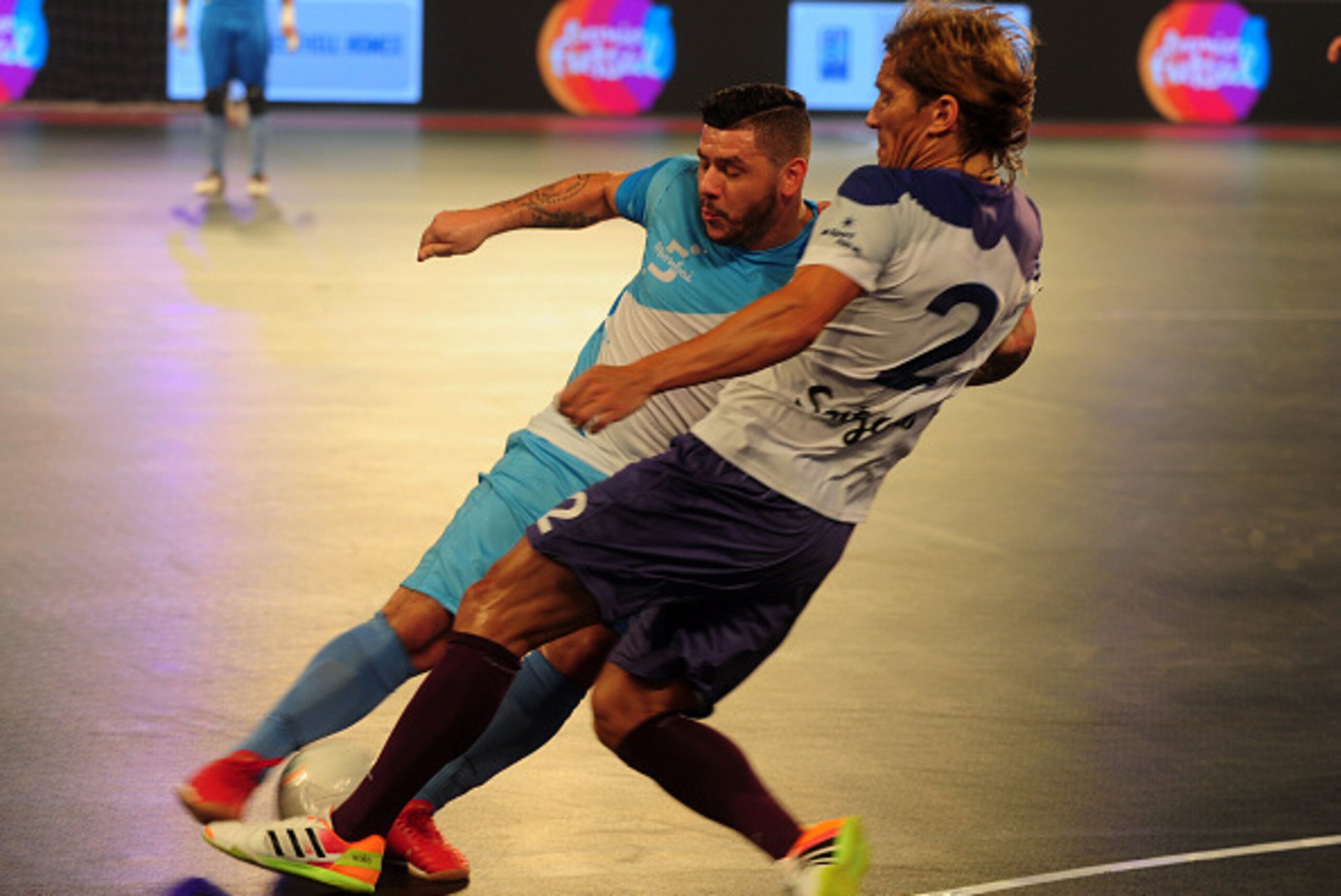 Mumbai's Fogila (L) plays against Kochi 5's Miguel Salgado during their Premier Futsal Football League match in Chennai on July 16, 2016. / AFP / ARUN SANKAR        (Photo credit should read ARUN SANKAR/AFP/Getty Images)