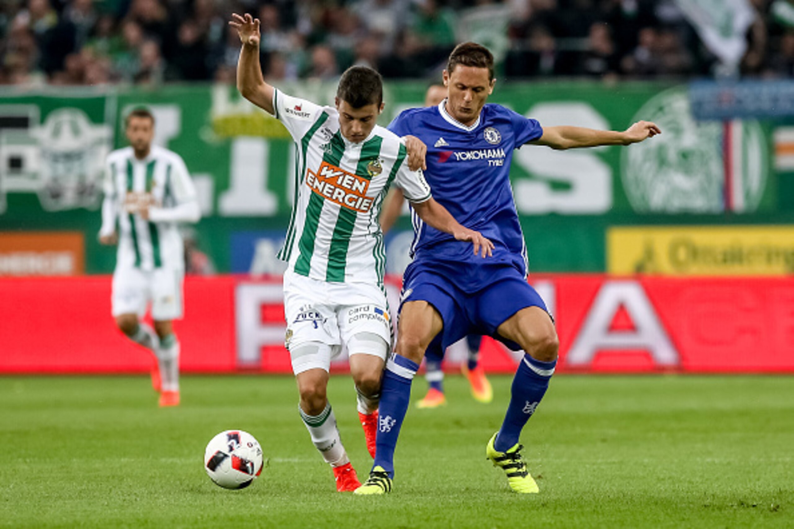 VIENNA, AUSTRIA - JULY 16:  Nemanja Matic (R) of Chelsea competes for the ball with Tamas Szanto (L) of Rapid Vienna during an friendly match between SK Rapid Vienna and Chelsea F.C. at Allianz Stadion on July 16, 2016 in Vienna, Austria.  (Photo by Matej