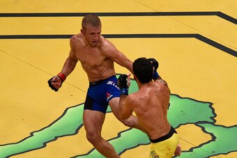 LAS VEGAS, NV - JULY 09: An overhead view of the Octagon as TJ Dillashaw (top) kicks Raphael Assuncao of Brazil during the UFC 200 event on July 9, 2016 at T-Mobile Arena in Las Vegas, Nevada.  (Photo by Jeff Bottari/Zuffa LLC/Zuffa LLC via Getty Images)