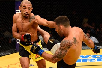 LAS VEGAS, NV - JULY 09: (L-R) Jose Aldo of Brazil punches Frankie Edgar in their UFC interim featherweight championship bout during the UFC 200 event on July 9, 2016 at T-Mobile Arena in Las Vegas, Nevada.  (Photo by Josh Hedges/Zuffa LLC/Zuffa LLC via G
