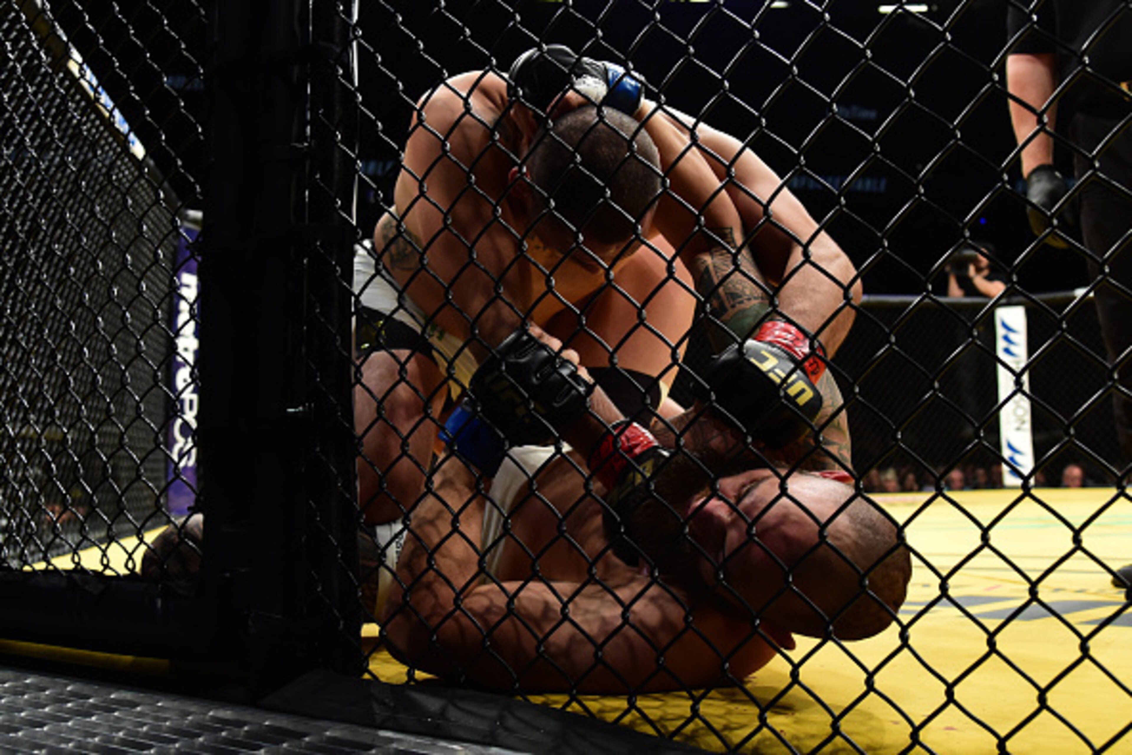 LAS VEGAS, NV - JULY 09: Cain Velasquez (top) punches Travis Browne in their heavyweight bout during the UFC 200 event on July 9, 2016 at T-Mobile Arena in Las Vegas, Nevada.  (Photo by Harry How/Zuffa LLC/Zuffa LLC via Getty Images)