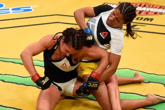 LAS VEGAS, NV - JULY 09:  Julianna Pena (right) punches Cat Zingano in their women's bantamweight bout during the UFC 200 event on July 9, 2016 at T-Mobile Arena in Las Vegas, Nevada.  (Photo by Josh Hedges/Zuffa LLC/Zuffa LLC via Getty Images)