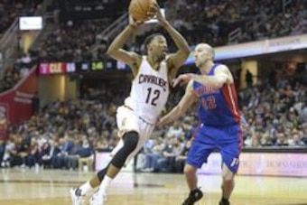 Apr 13, 2016; Cleveland, OH, USA; Cleveland Cavaliers guard Jordan McRae (12) drives against Detroit Pistons guard Steve Blake (22) in the third quarter at Quicken Loans Arena. Mandatory Credit: David Richard-USA TODAY Sports