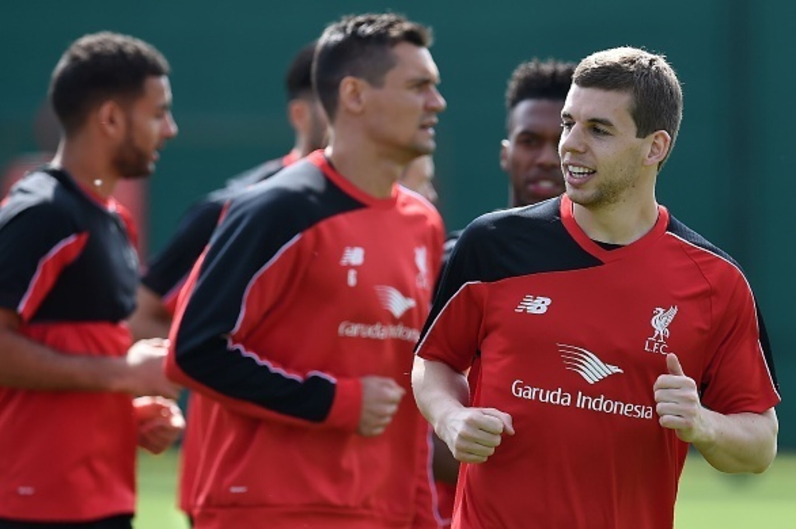 Liverpool's English defender Jon Flanagan (R) warms-up with teammates during a team training session at their Melwood training complex in Liverpool, north west England, on May 13, 2016.
Liverpool face Sevilla in the Europa League final on May 18, 2016, wi
