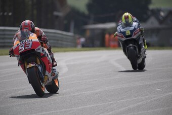 HOHENSTEIN-ERNSTTHAL, SAXONY - JULY 16: Marc Marquez of Spain and Repsol Honda Team leads Hector Barbera of Spain and Avintia Racing during the MotoGp of Germany - Qualifying at Sachsenring Circuit on July 16, 2016 in Hohenstein-Ernstthal, Germany.  (Phot