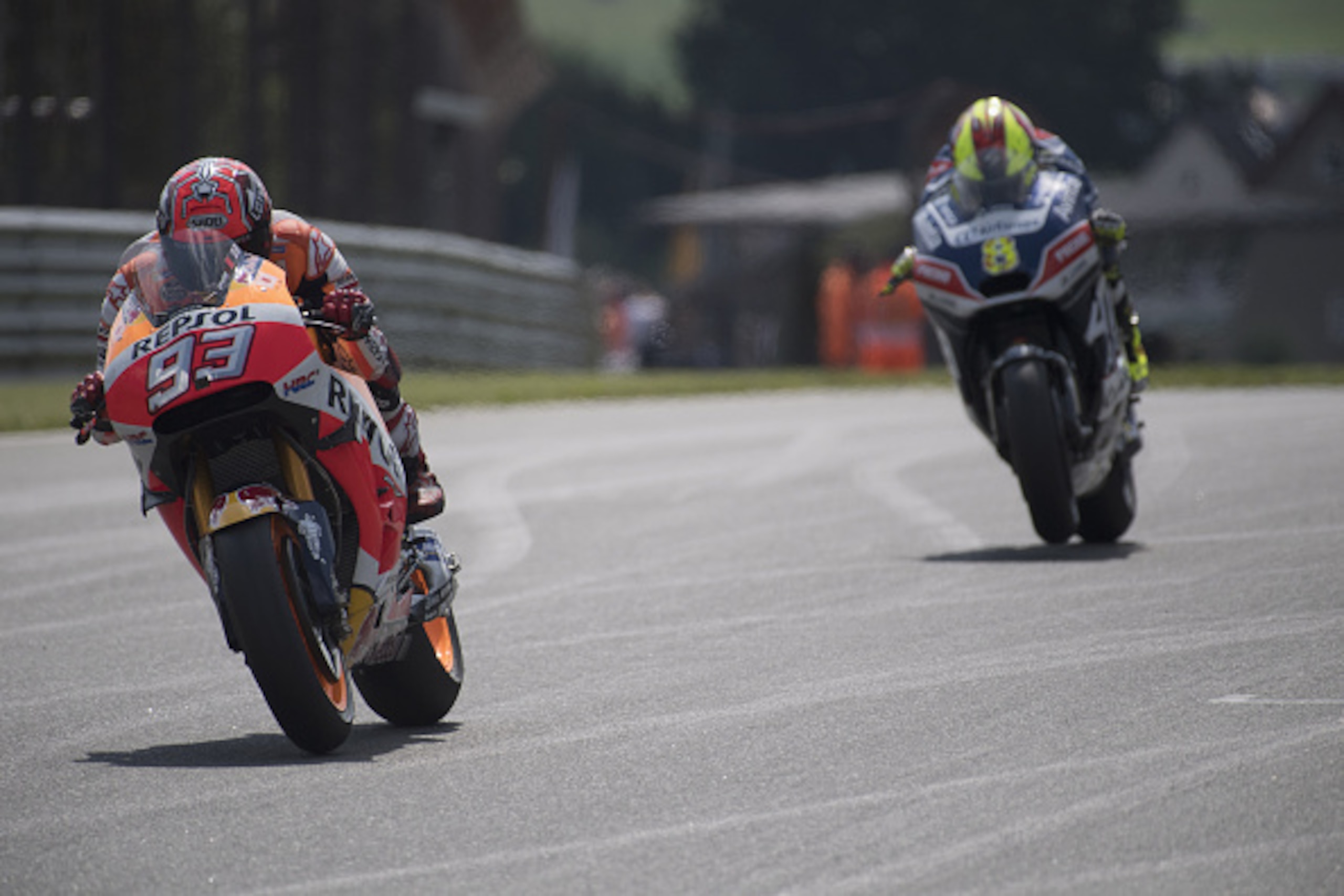 HOHENSTEIN-ERNSTTHAL, SAXONY - JULY 16: Marc Marquez of Spain and Repsol Honda Team leads Hector Barbera of Spain and Avintia Racing during the MotoGp of Germany - Qualifying at Sachsenring Circuit on July 16, 2016 in Hohenstein-Ernstthal, Germany.  (Phot