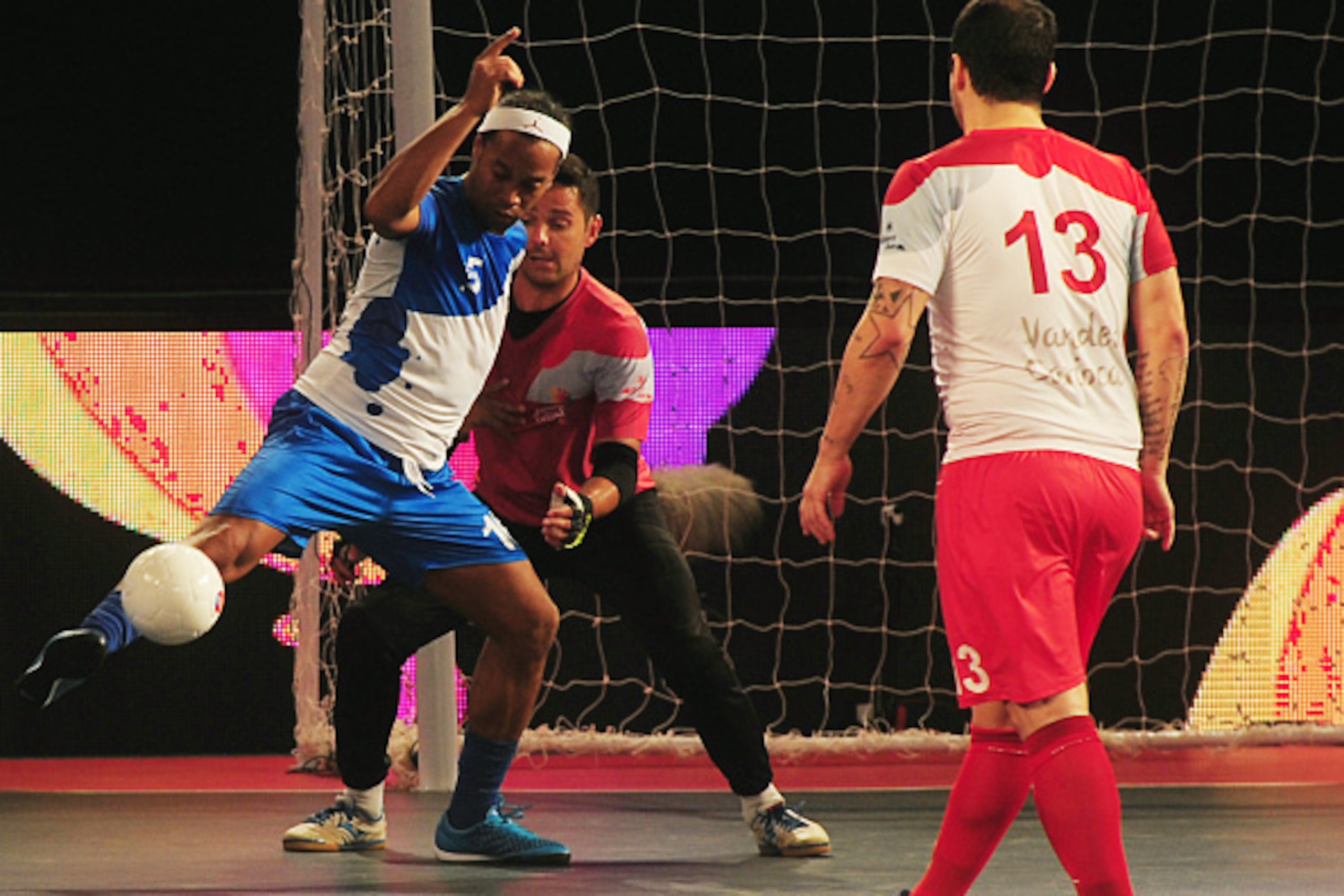 Ronaldhino (L) from the Goa 5's plays against the Kolkata 5's  during their Premier Futsal Football League match in Chennai on July 15, 2016. / AFP / ARUN SANKAR        (Photo credit should read ARUN SANKAR/AFP/Getty Images)