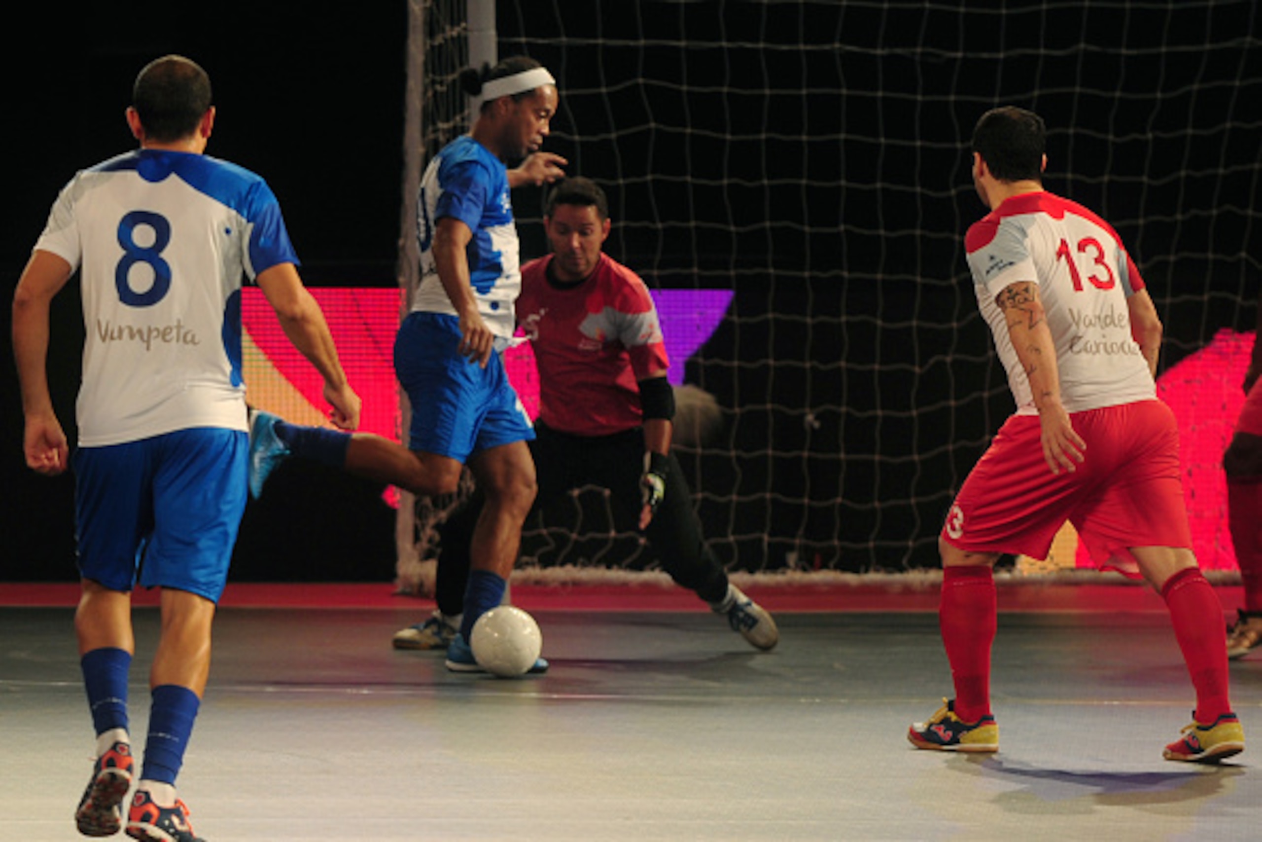 Ronaldhino (2L) from the Goa 5's plays against the Kolkata 5's  during their Premier Futsal Football League match in Chennai on July 15, 2016. / AFP / ARUN SANKAR        (Photo credit should read ARUN SANKAR/AFP/Getty Images)