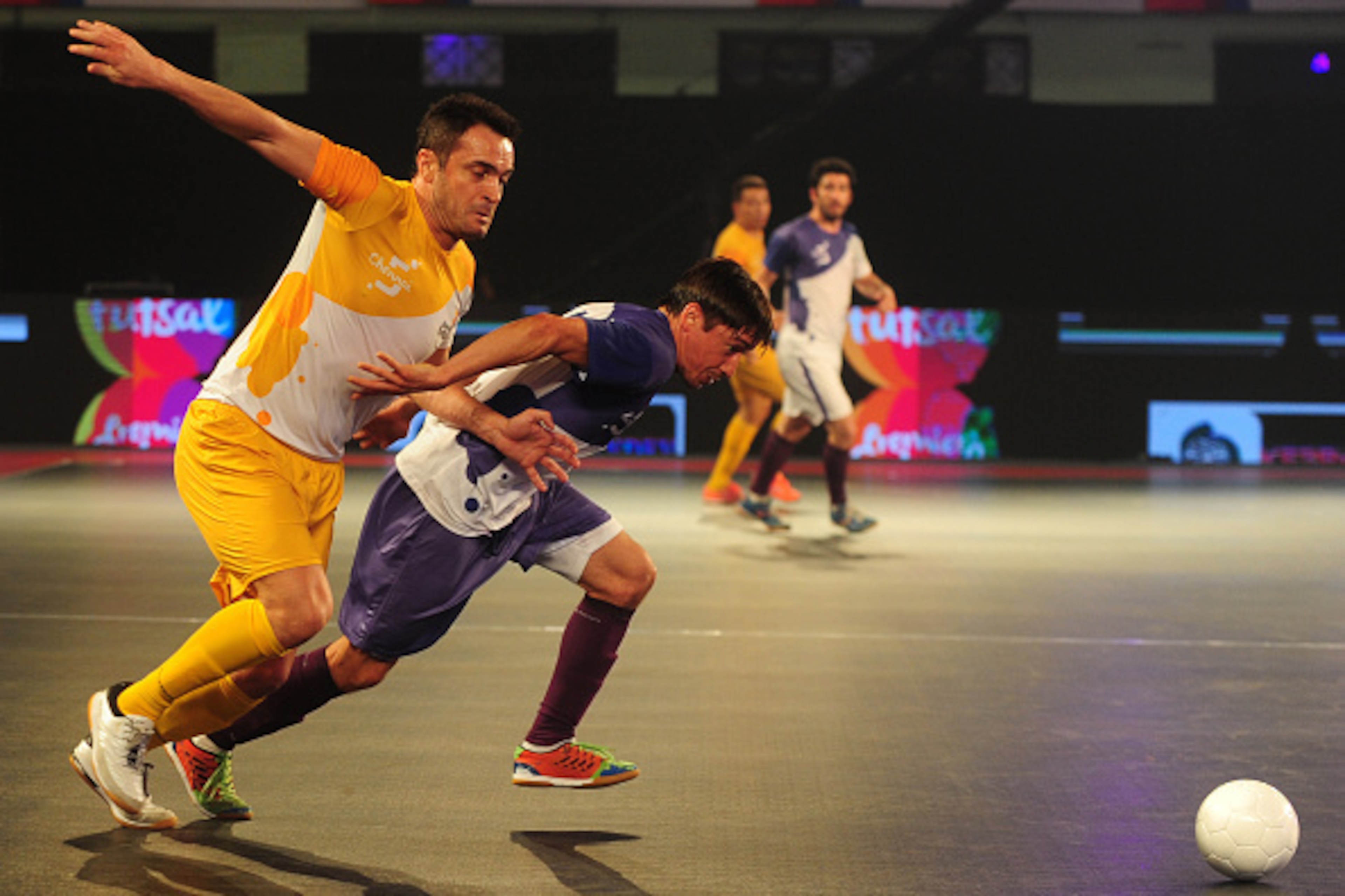 Alessandro Rosa Viera, also known Falcao, (L), from the Chennai 5's plays against the Kochi 5's Chaguinha during their Premier Futsal Football League match in Chennai on July 15, 2016 / AFP / ARUN SANKAR        (Photo credit should read ARUN SANKAR/AFP/Ge