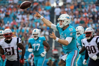 MIAMI GARDENS, FL - JANUARy 03: Ryan Tannehill #17 of the Miami Dolphins in action during the first quarter of the game against the New England Patriots at Sun Life Stadium on January 3, 2016 in Miami Gardens, Florida. (Photo by Mike Ehrmann/Getty Images)
