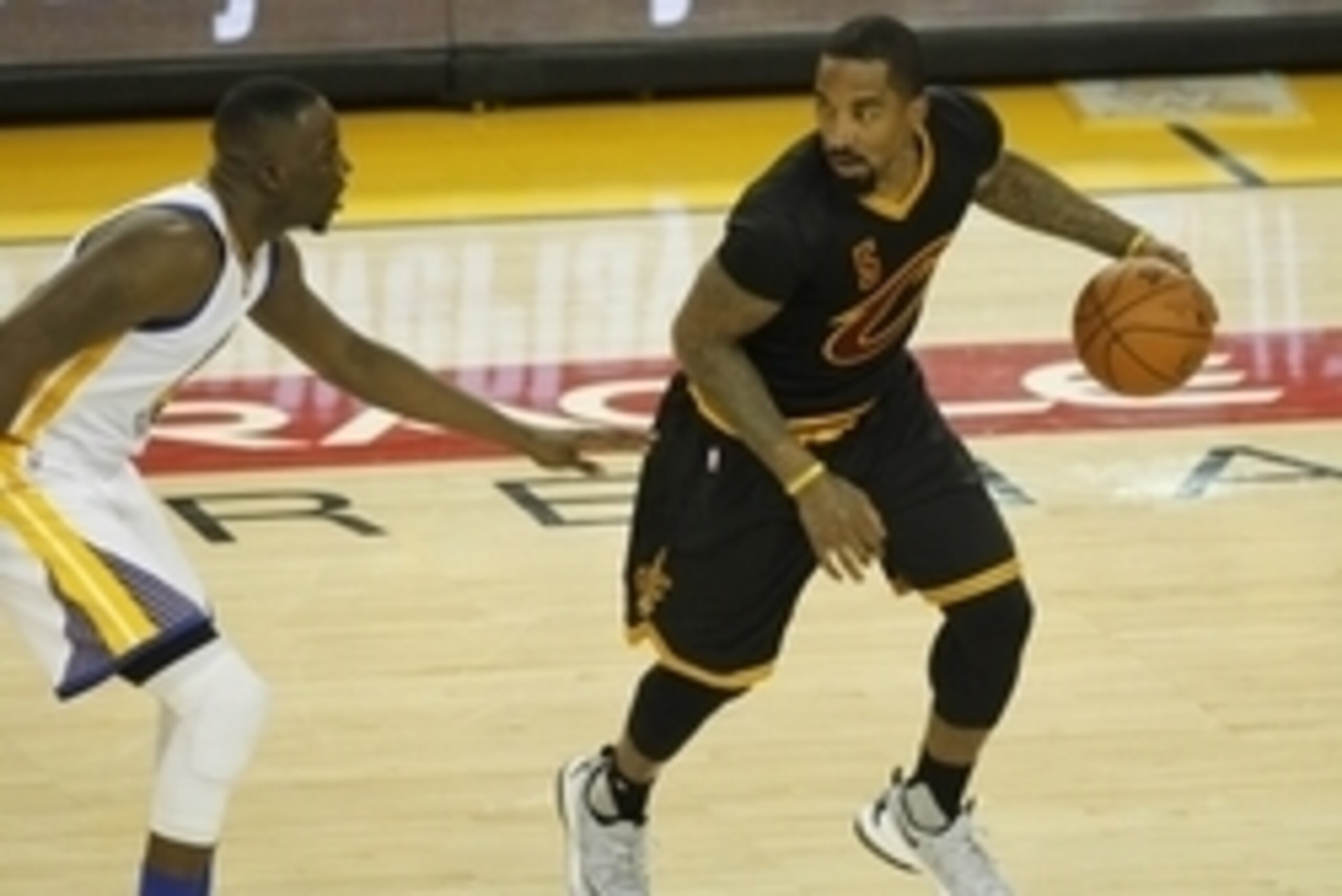 June 19, 2016; Oakland, CA, USA; Cleveland Cavaliers guard J.R. Smith (5) moves the ball against Golden State Warriors forward Draymond Green (23) in the second half in game seven of the NBA Finals at Oracle Arena. Mandatory Credit: Cary Edmondson-USA TOD